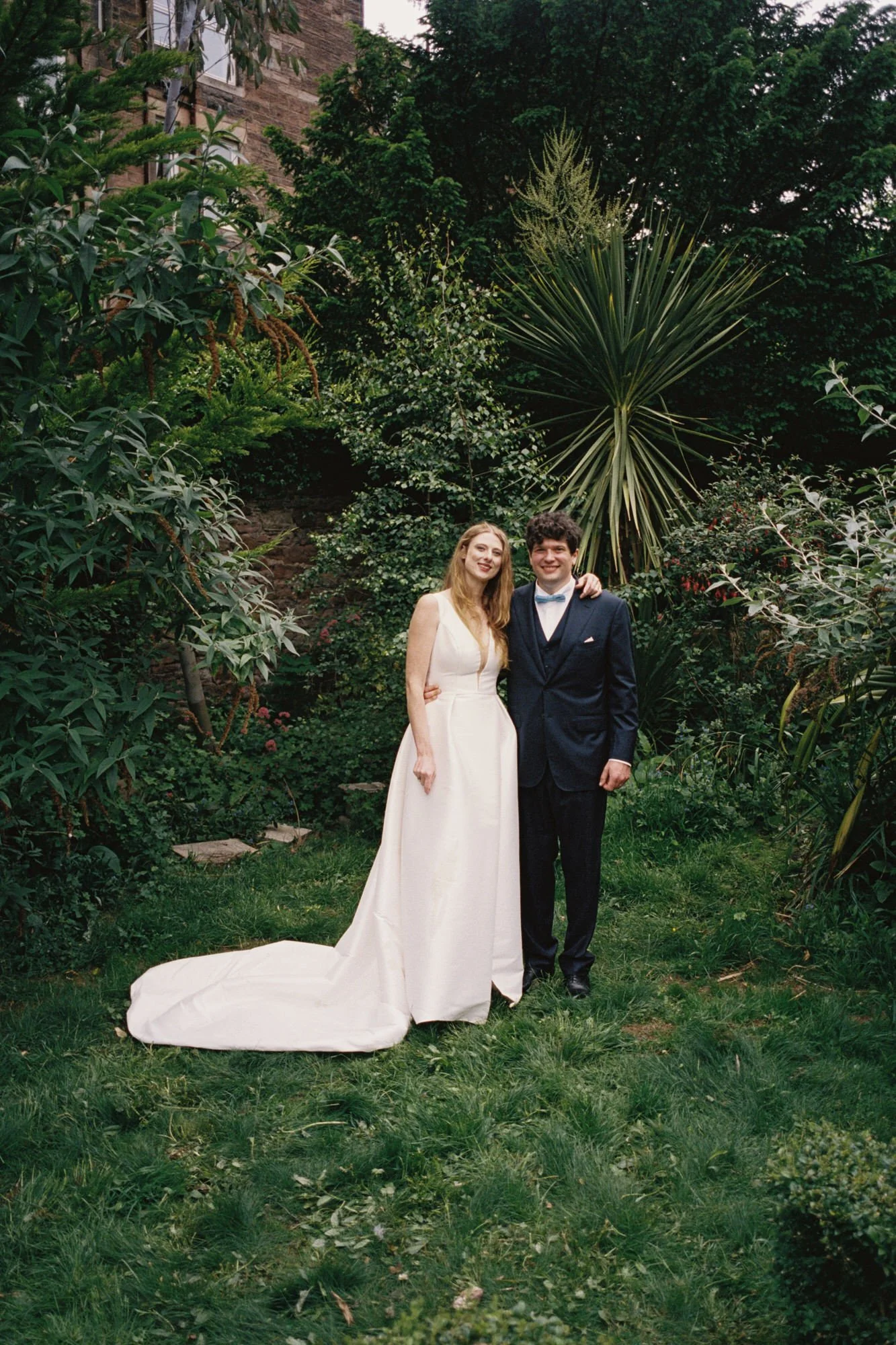 Newlywed couple walking through Edinburgh after their garden ceremony