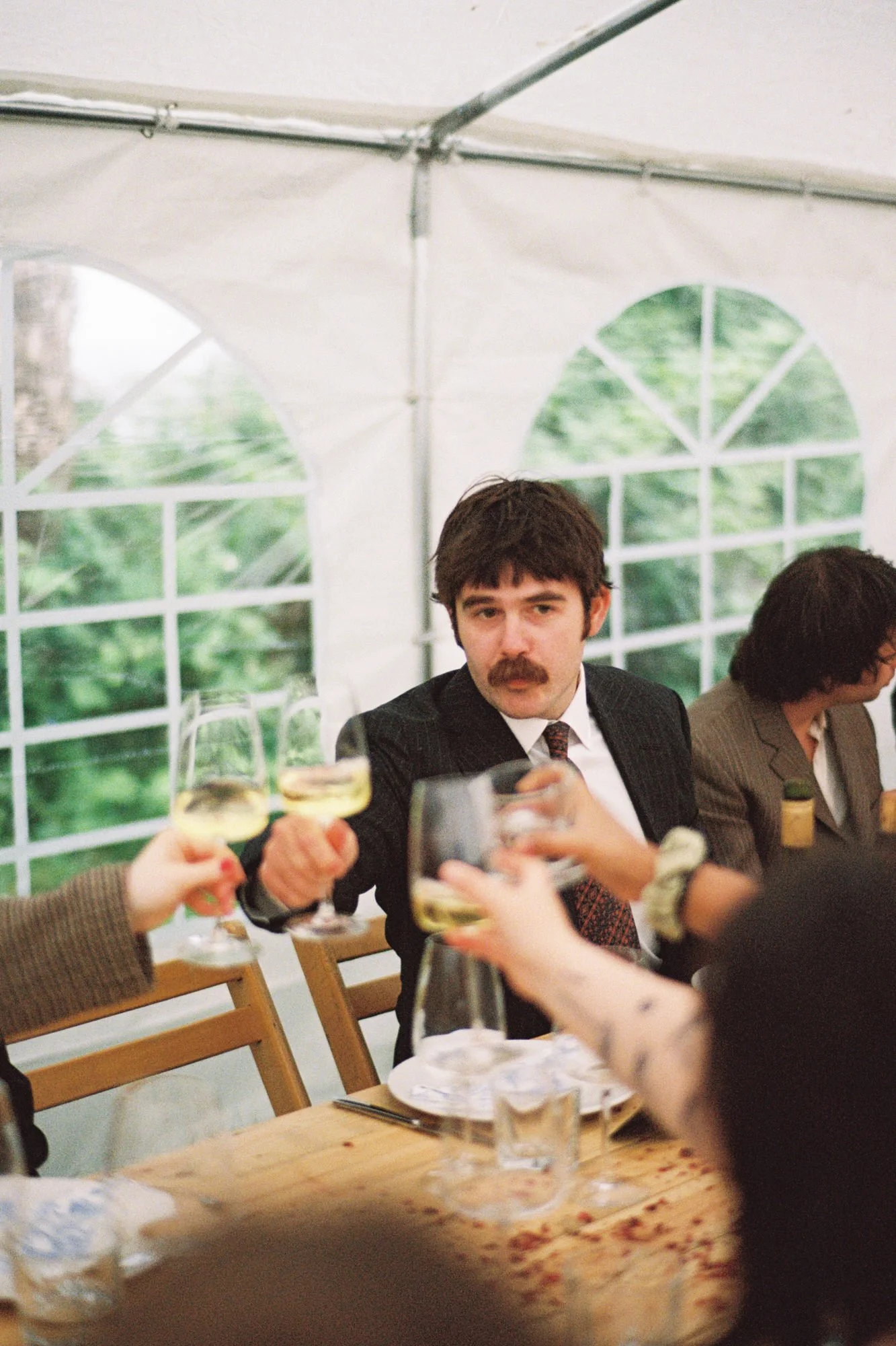 Warm documentary photograph from an Edinburgh garden wedding