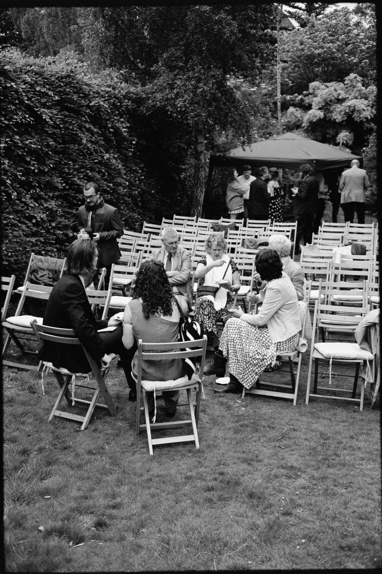 Friends and family photographed on film during the garden celebration