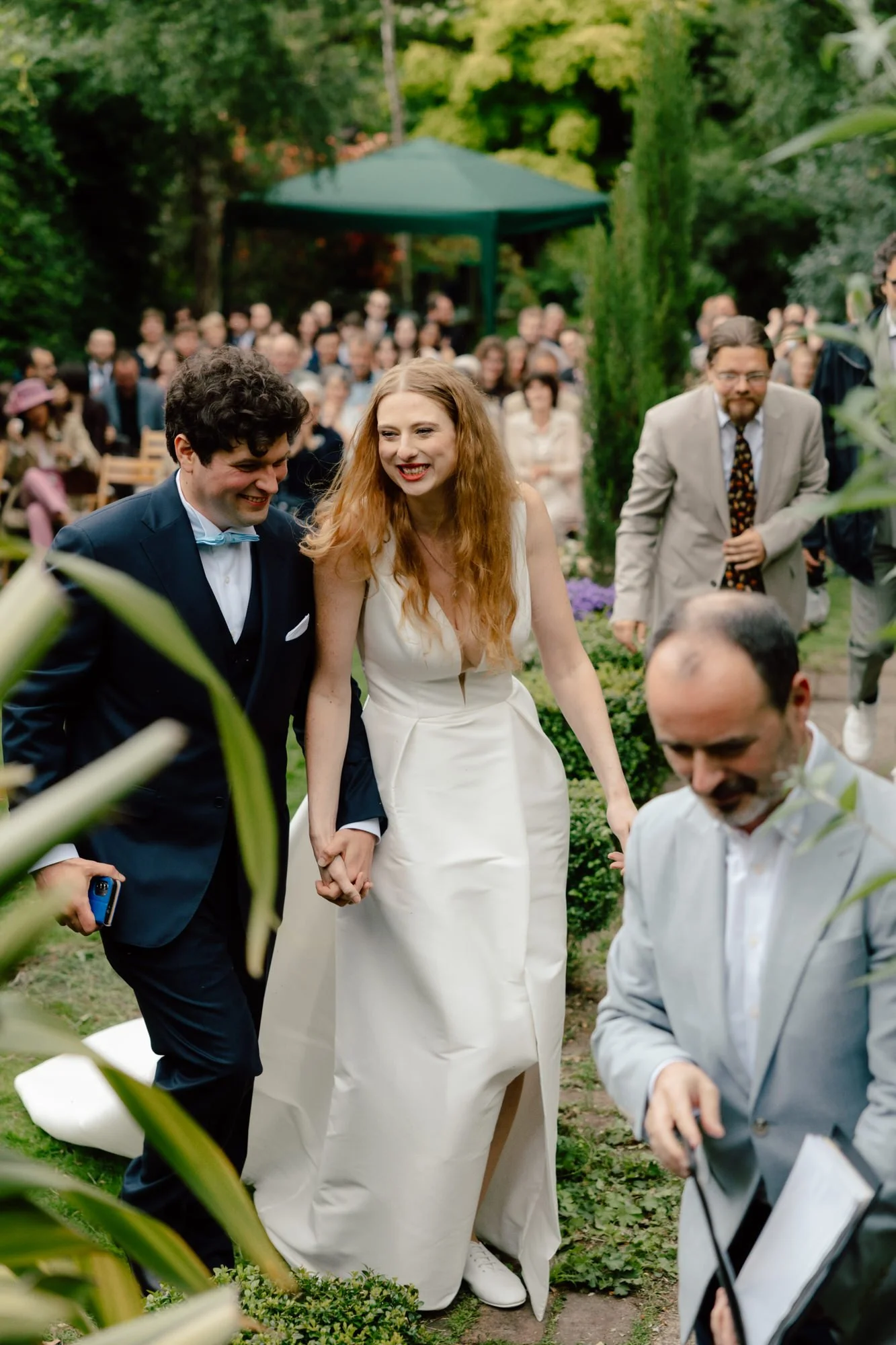 Guests gathered closely for an intimate Edinburgh garden ceremony