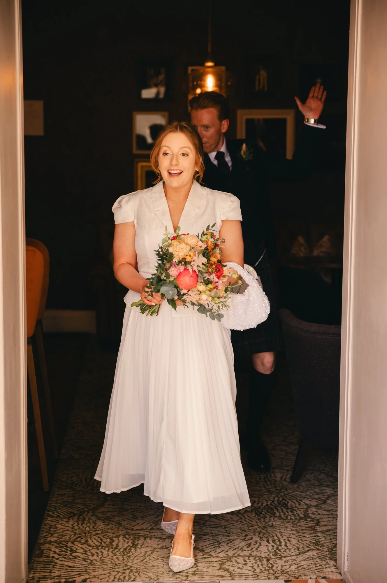 Hazel holding a keepsake before her wedding at Hotel du Vin St Andrews