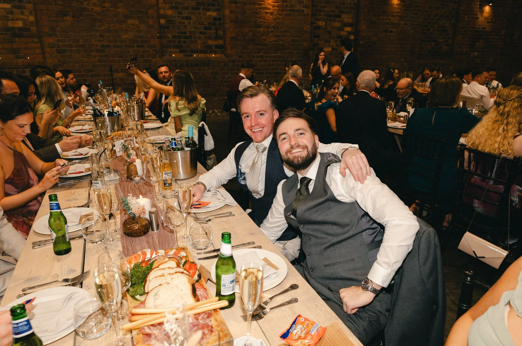 Hazel and Ally greeting friends at their Glasgow wedding party