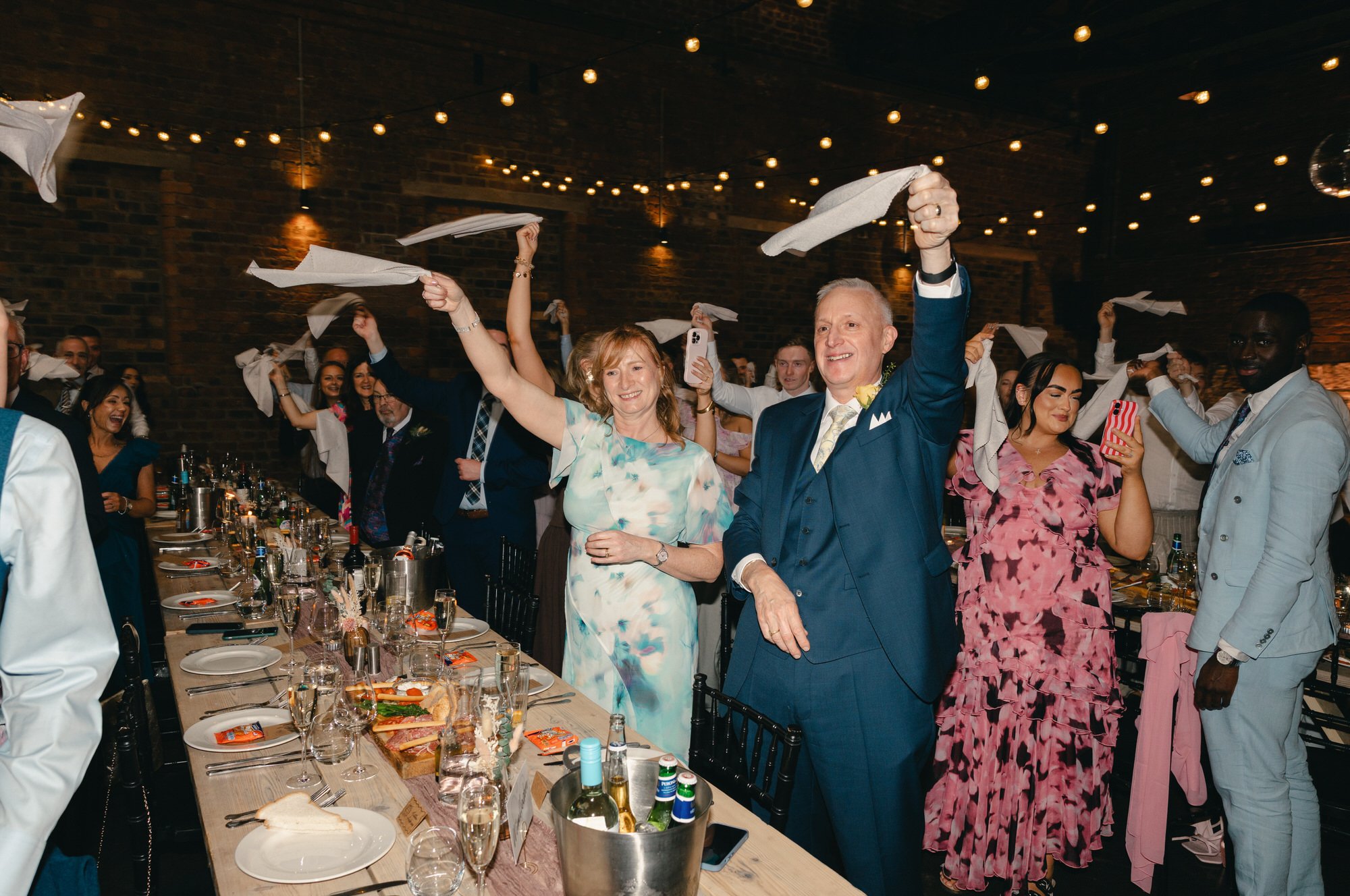 Wedding guests gathering inside The Engine Works in Glasgow