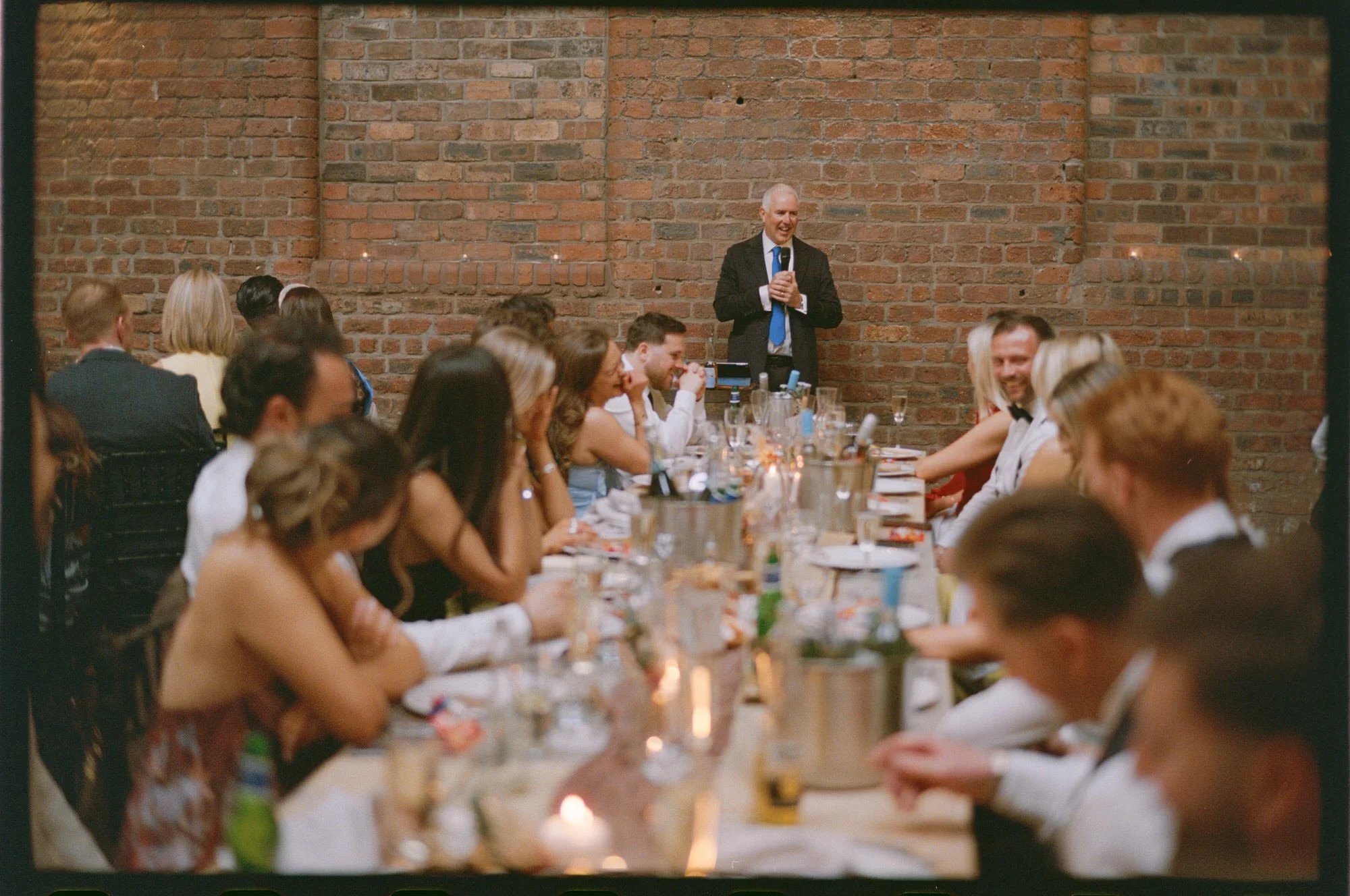 Candid film photograph during Hazel and Ally’s Glasgow wedding reception