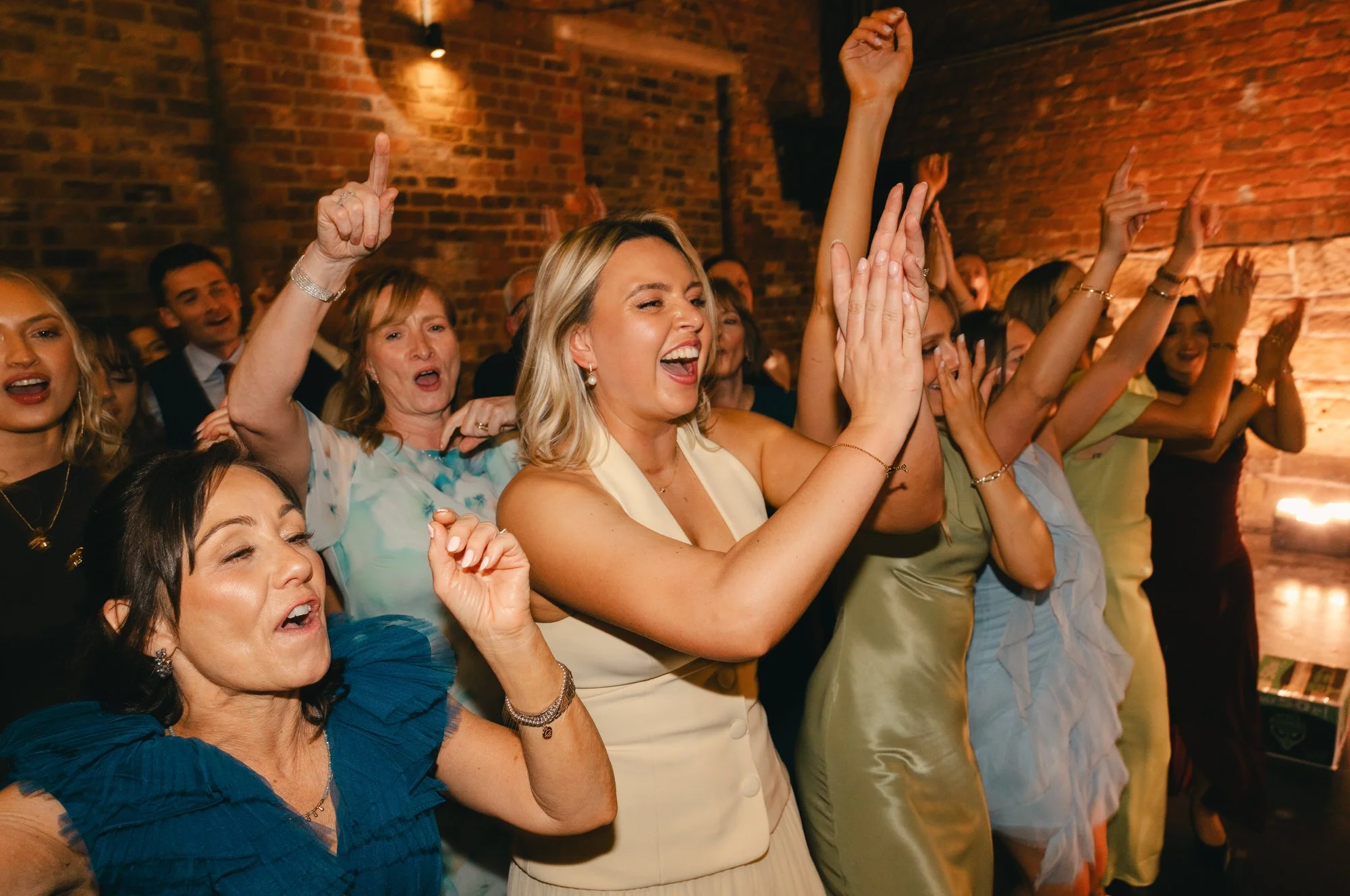Joyful candid moment during Hazel and Ally’s Engine Works celebration