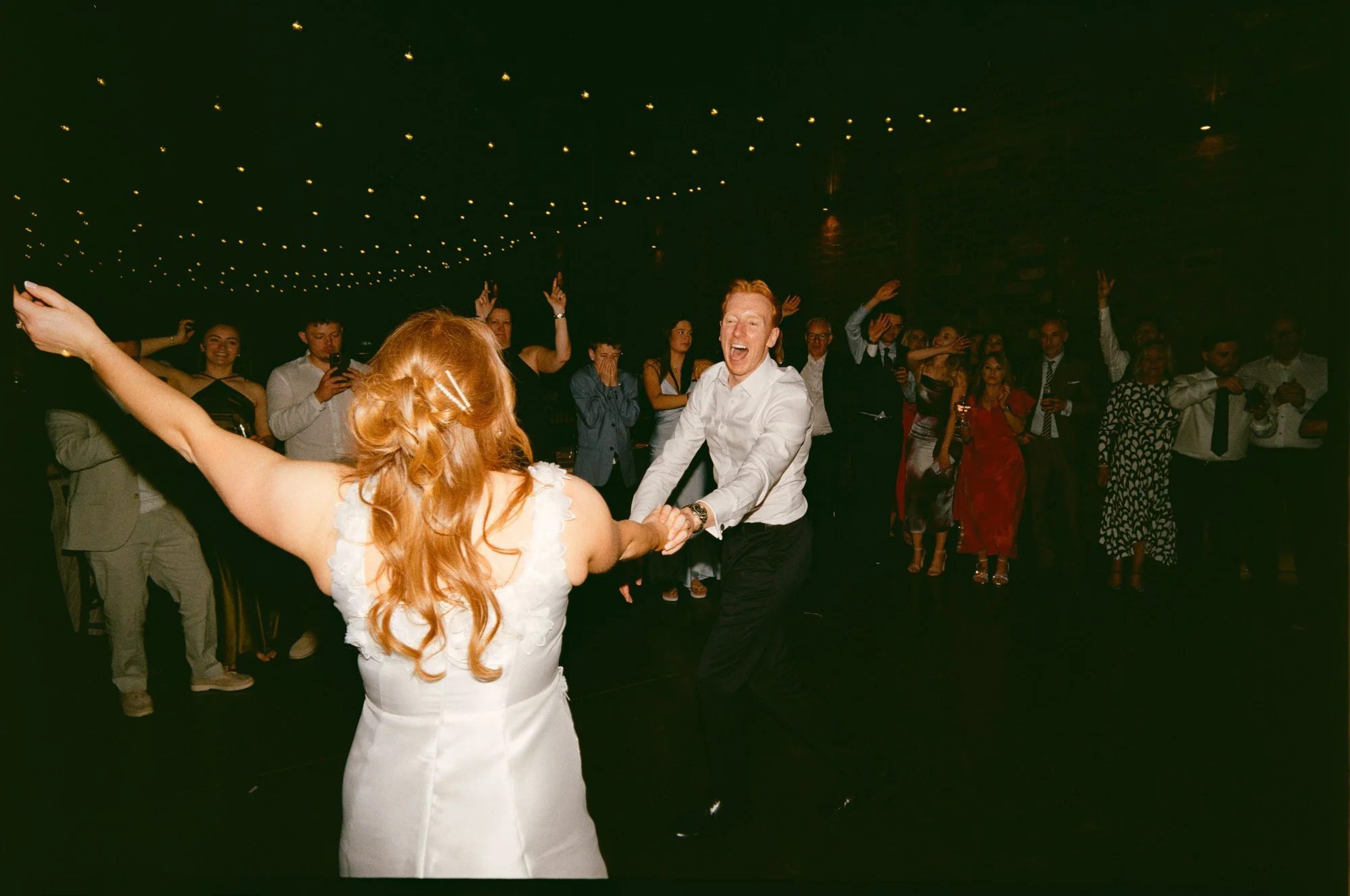 Direct-flash film photograph from the Glasgow wedding party