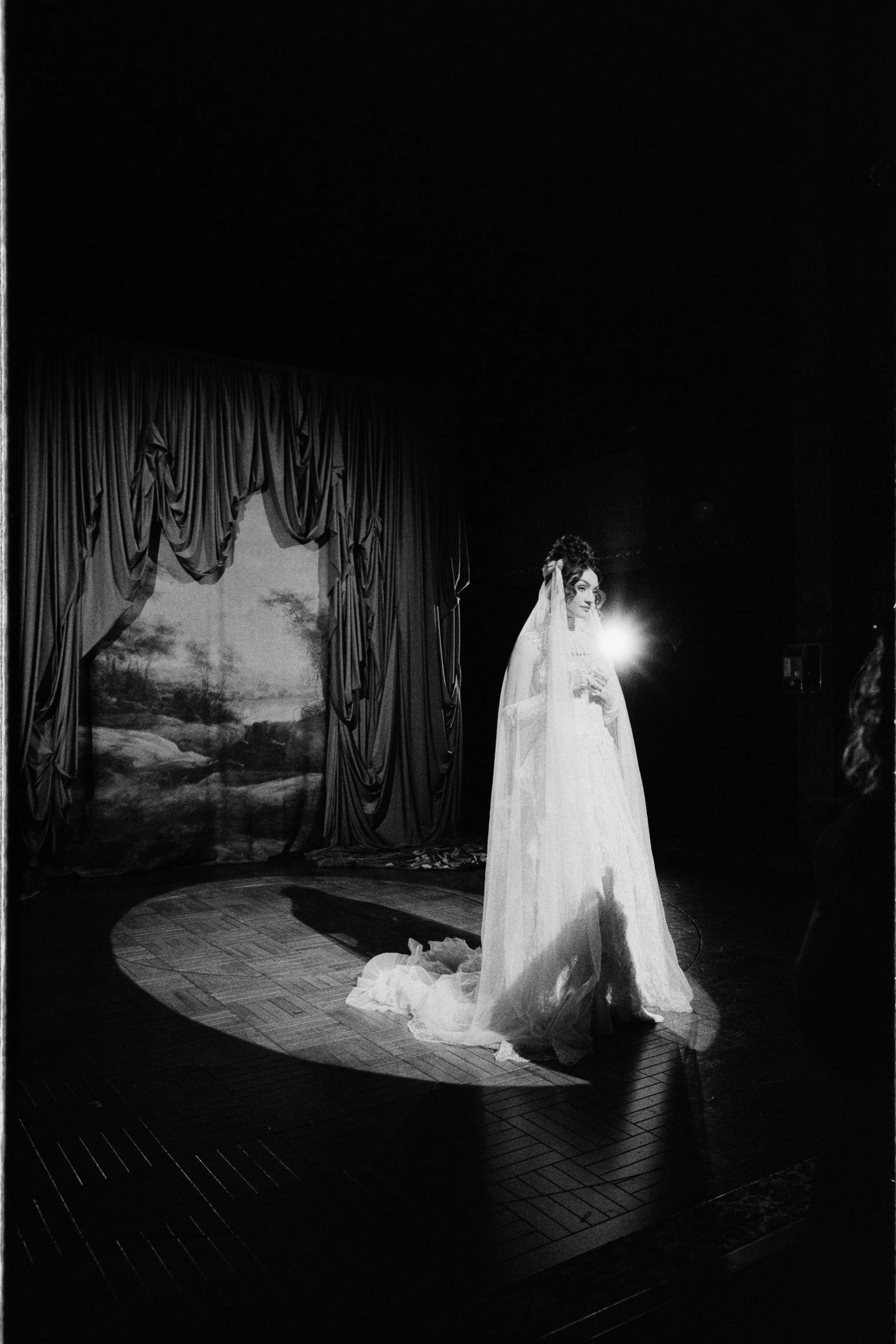Two performers crossing the stage during the conceptual opera shoot