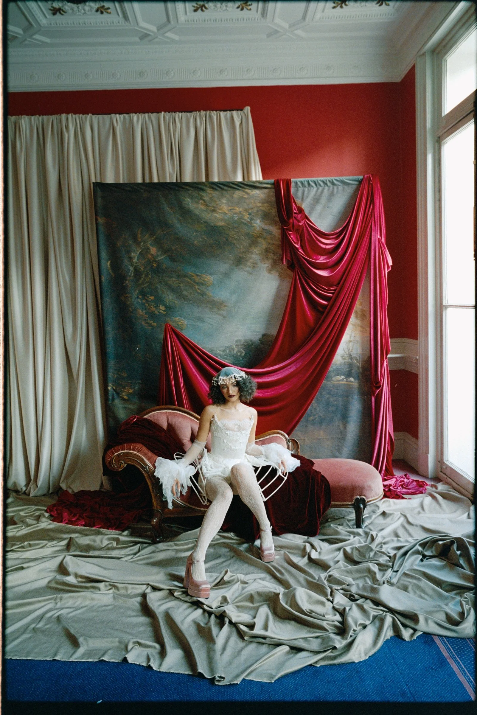 Performer reclining in costume during the Edinburgh film photography workshop