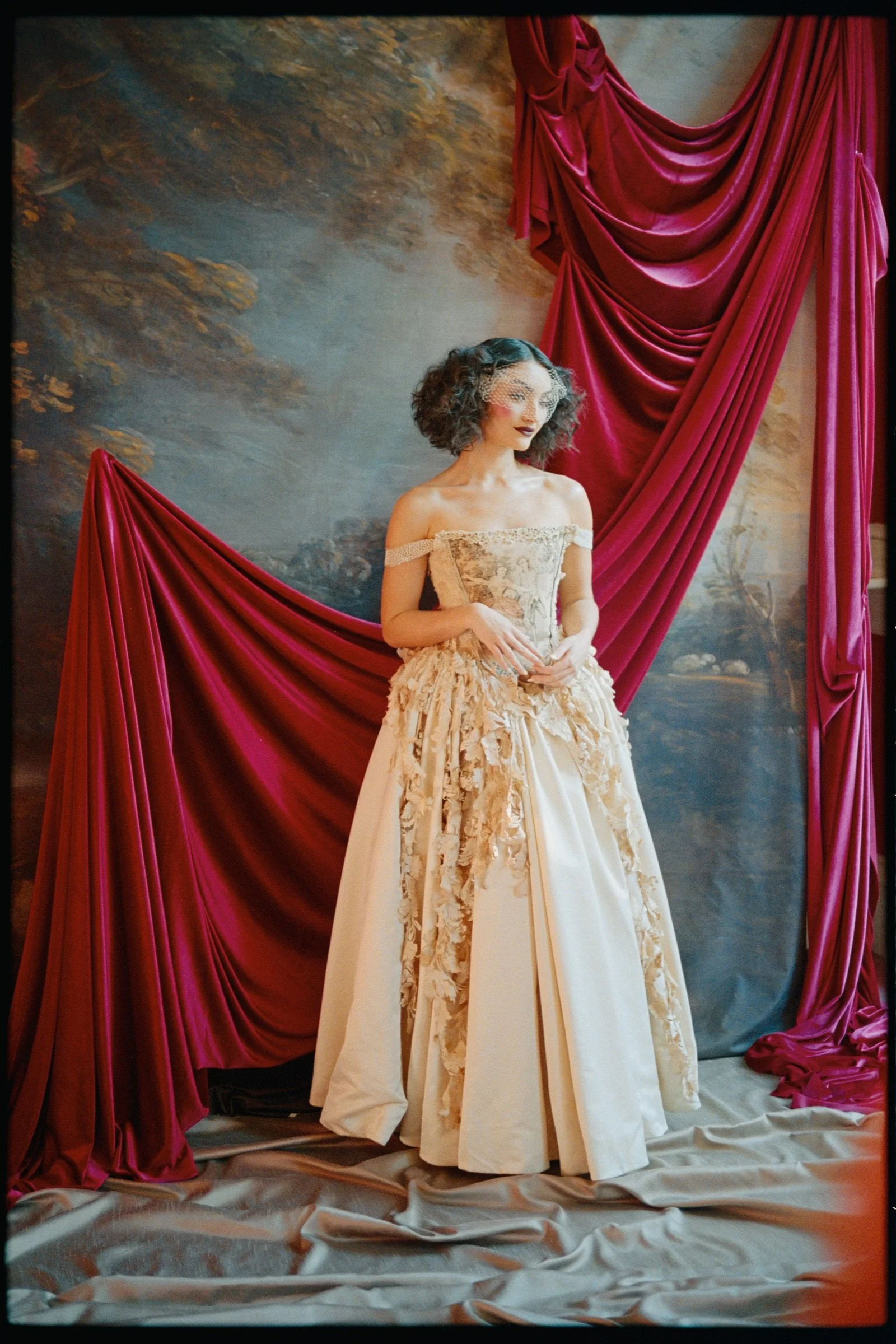 Full-length portrait of a performer in an embroidered gown on Portra 800