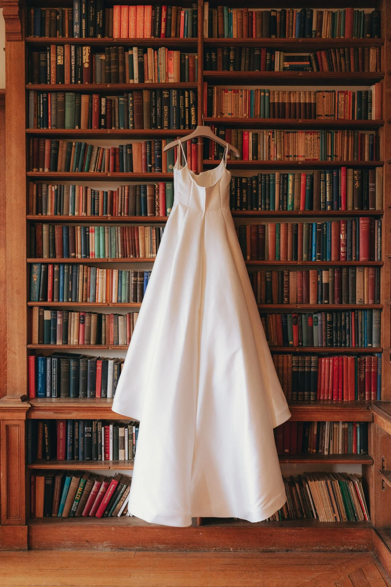 wedding-dress-hanging-in-carberry-tower-library.jpg