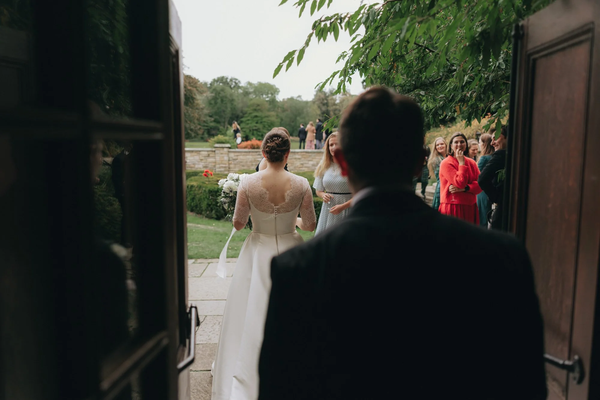 newlyweds-walking-through-carberry-tower-gardens.jpg