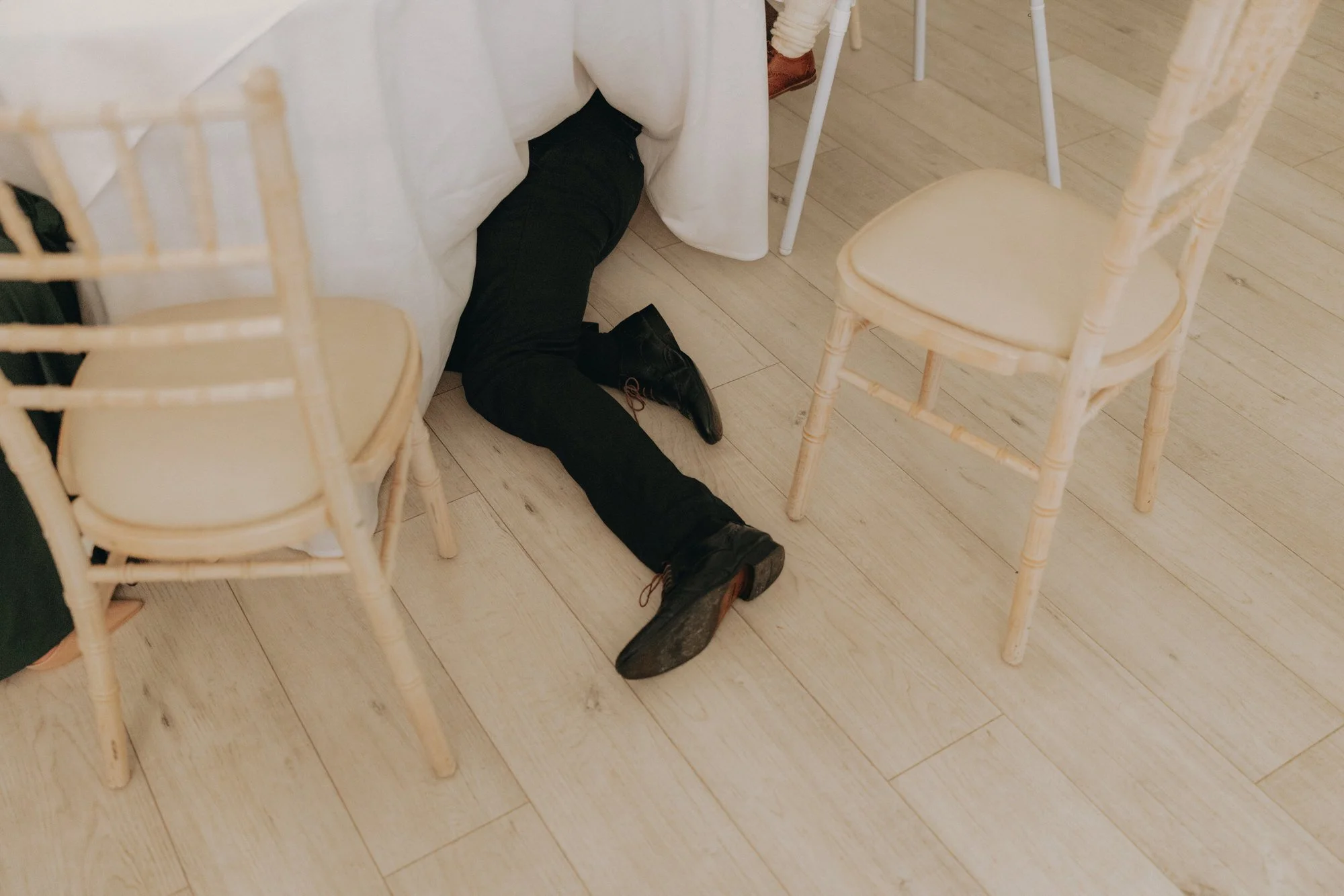 funny-shoe-moment-during-carberry-tower-reception.jpg