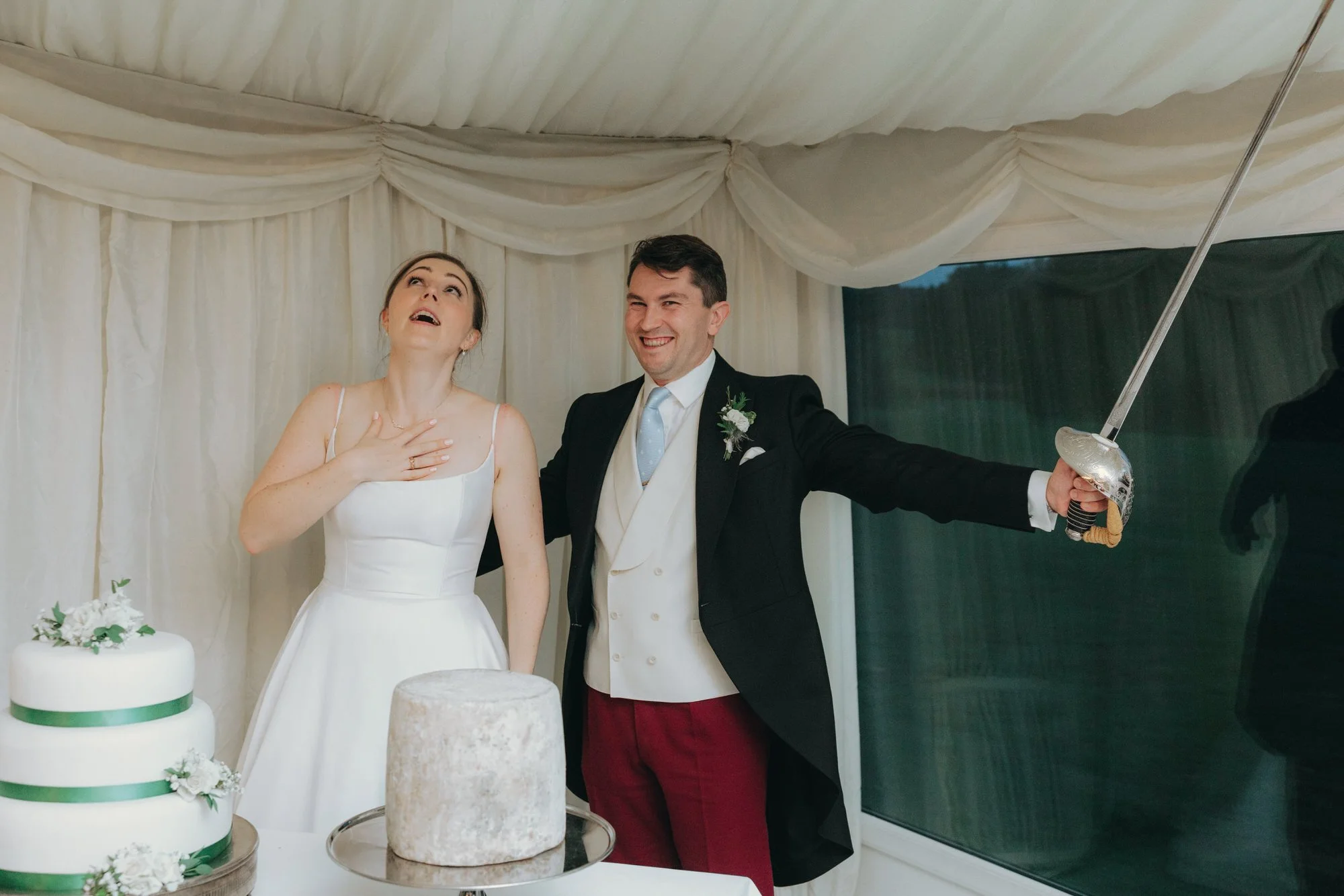 candid-cake-cutting-at-carberry-tower-wedding.jpg