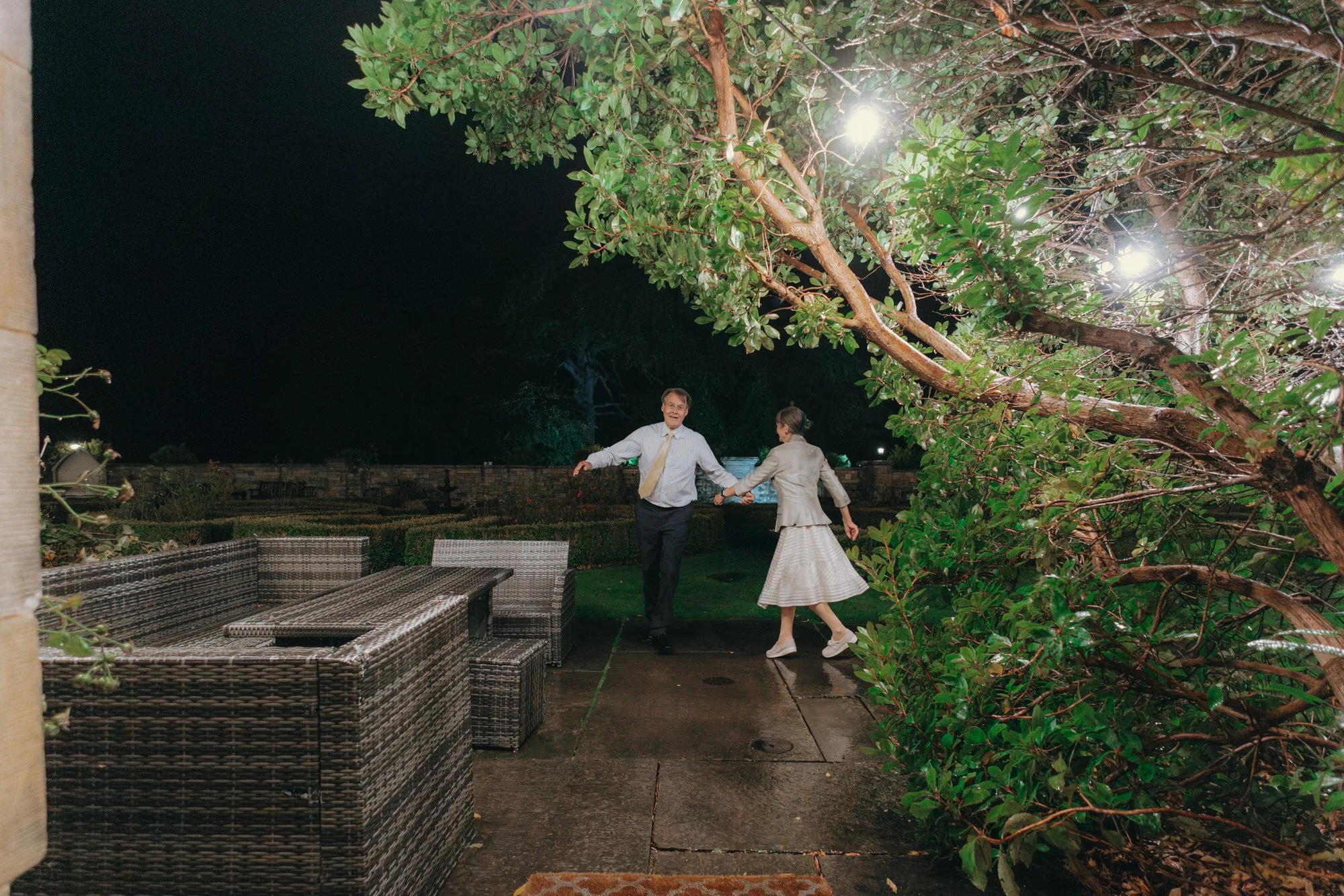 katy-and-will-running-through-carberry-tower-garden-at-night.jpg