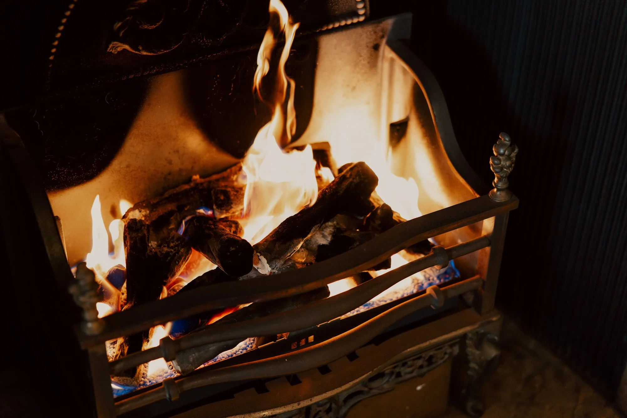 Logs burning in a fireplace at the Balmoral Hotel.