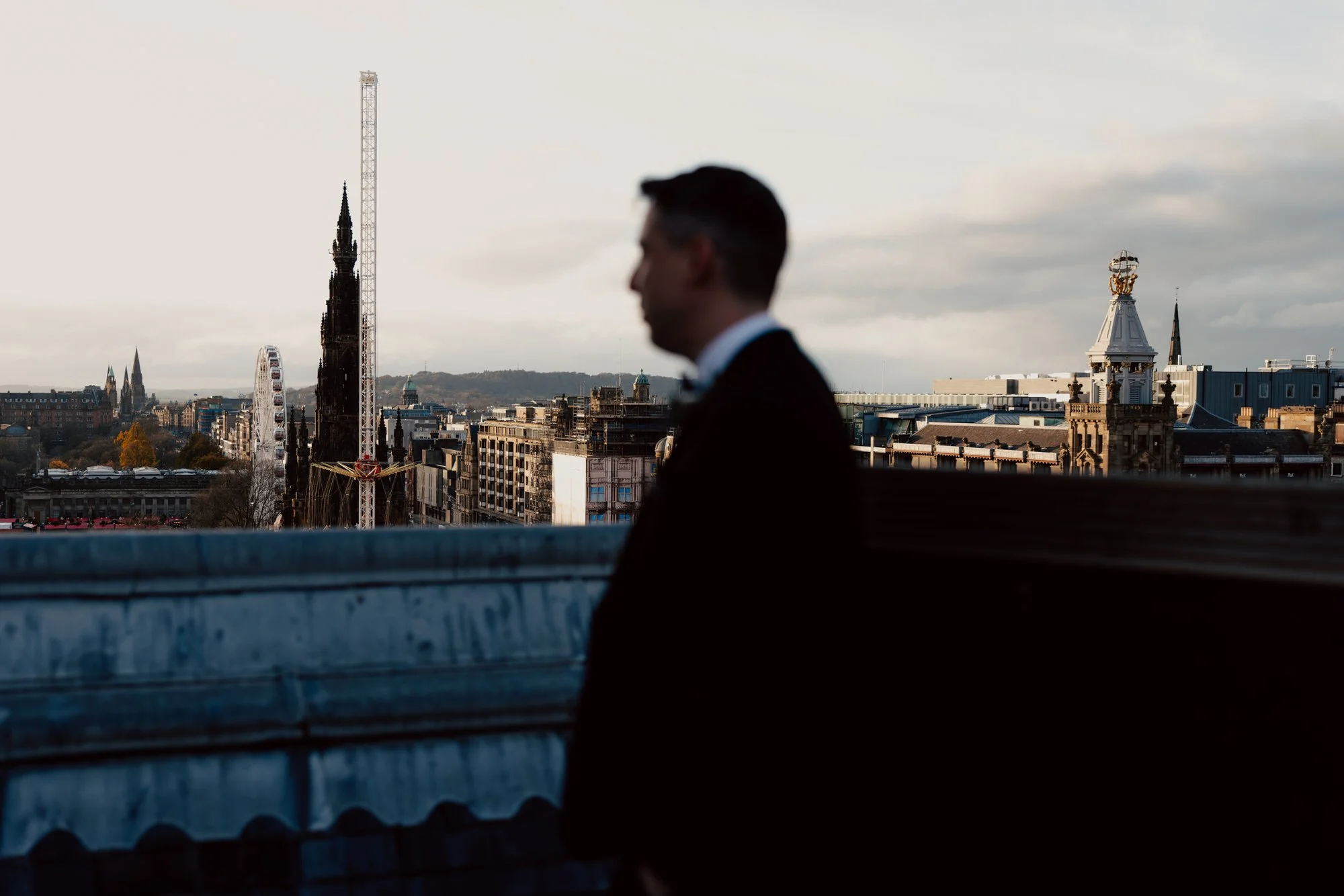 Vincent looking across the Edinburgh skyline from the Balmoral rooftop.