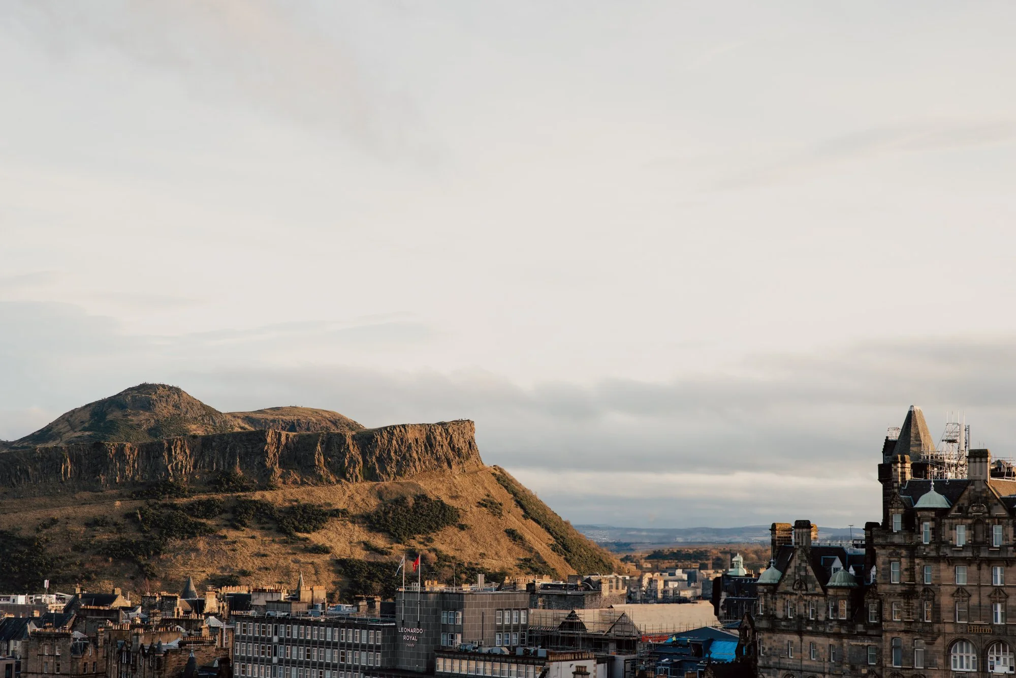 Arthur’s Seat and Edinburgh rooftops in winter light.