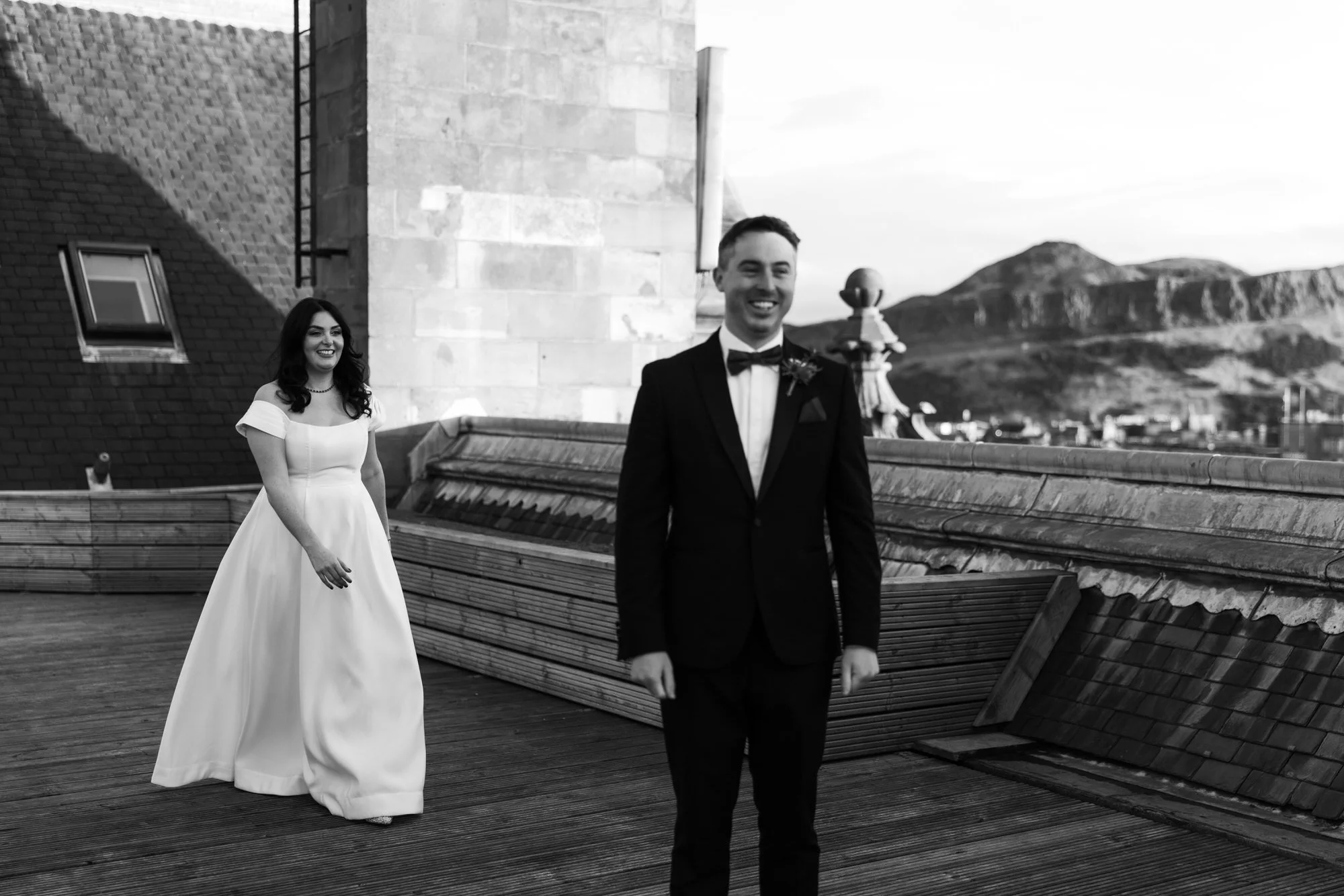 Milly approaching Vincent on the Balmoral rooftop before their ceremony.