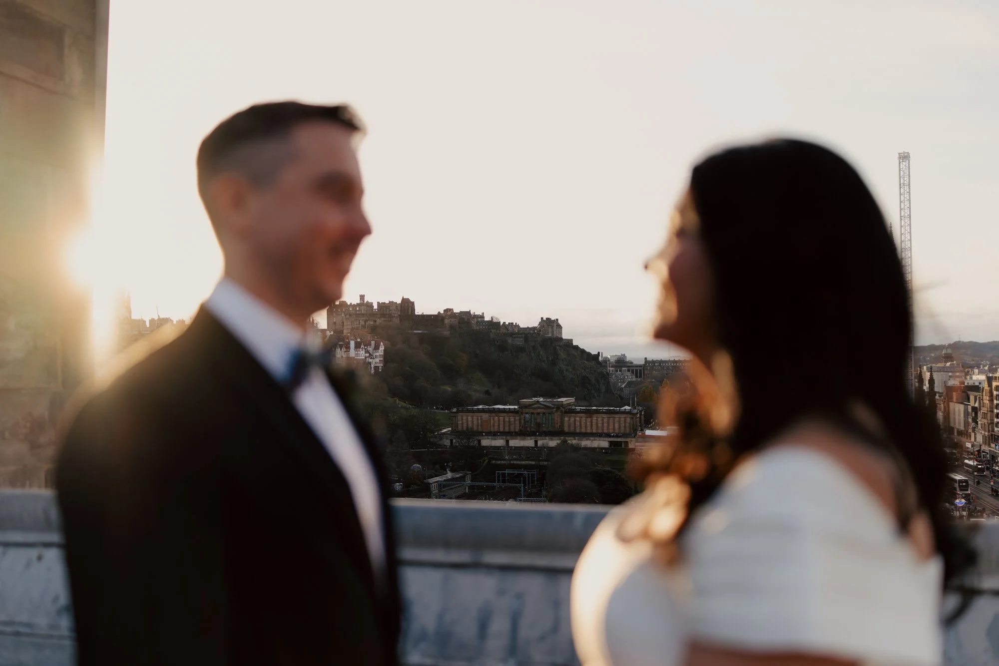 Softly focused portrait of the couple with sunlight behind Vincent.