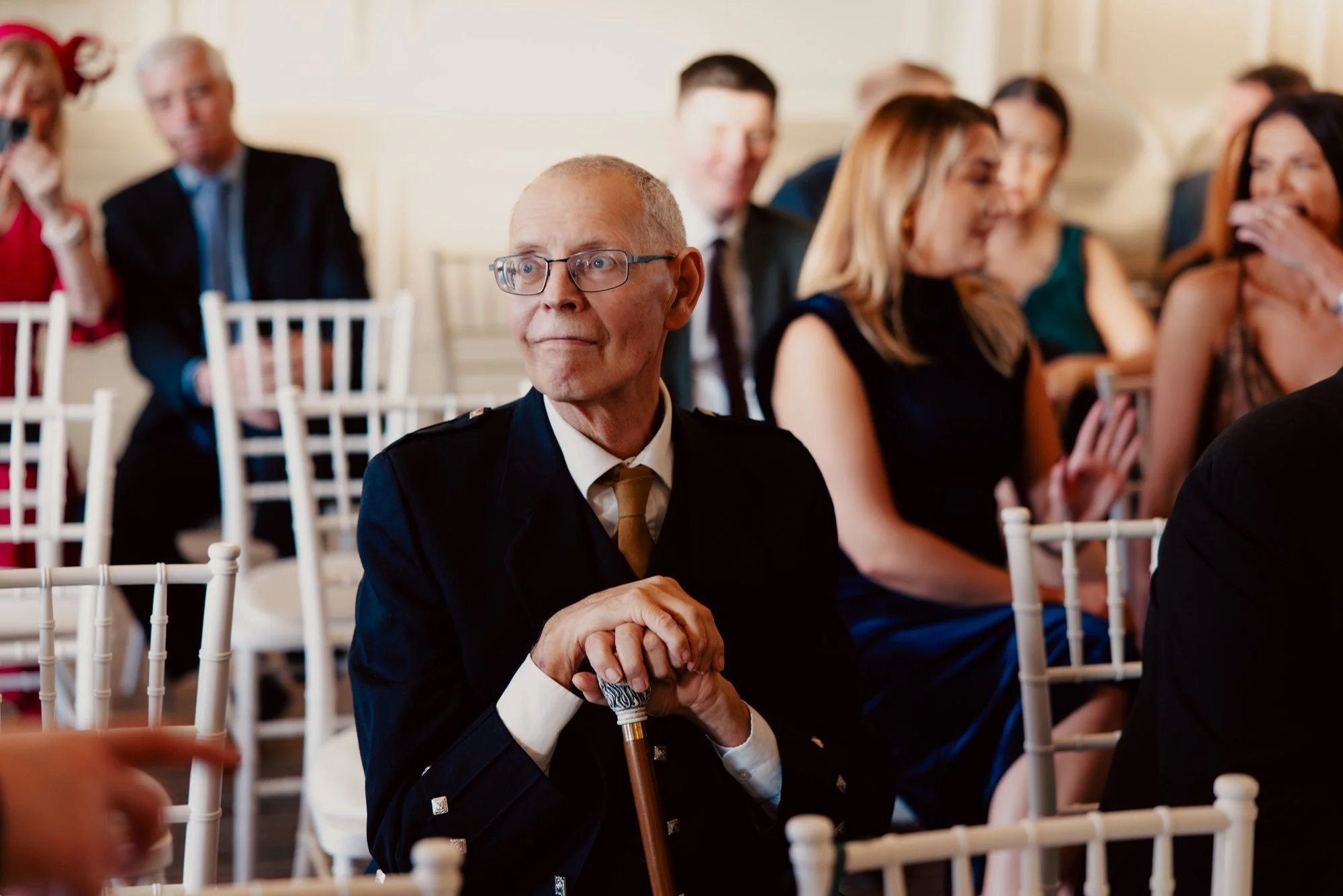 A wedding guest seated in the ceremony room.
