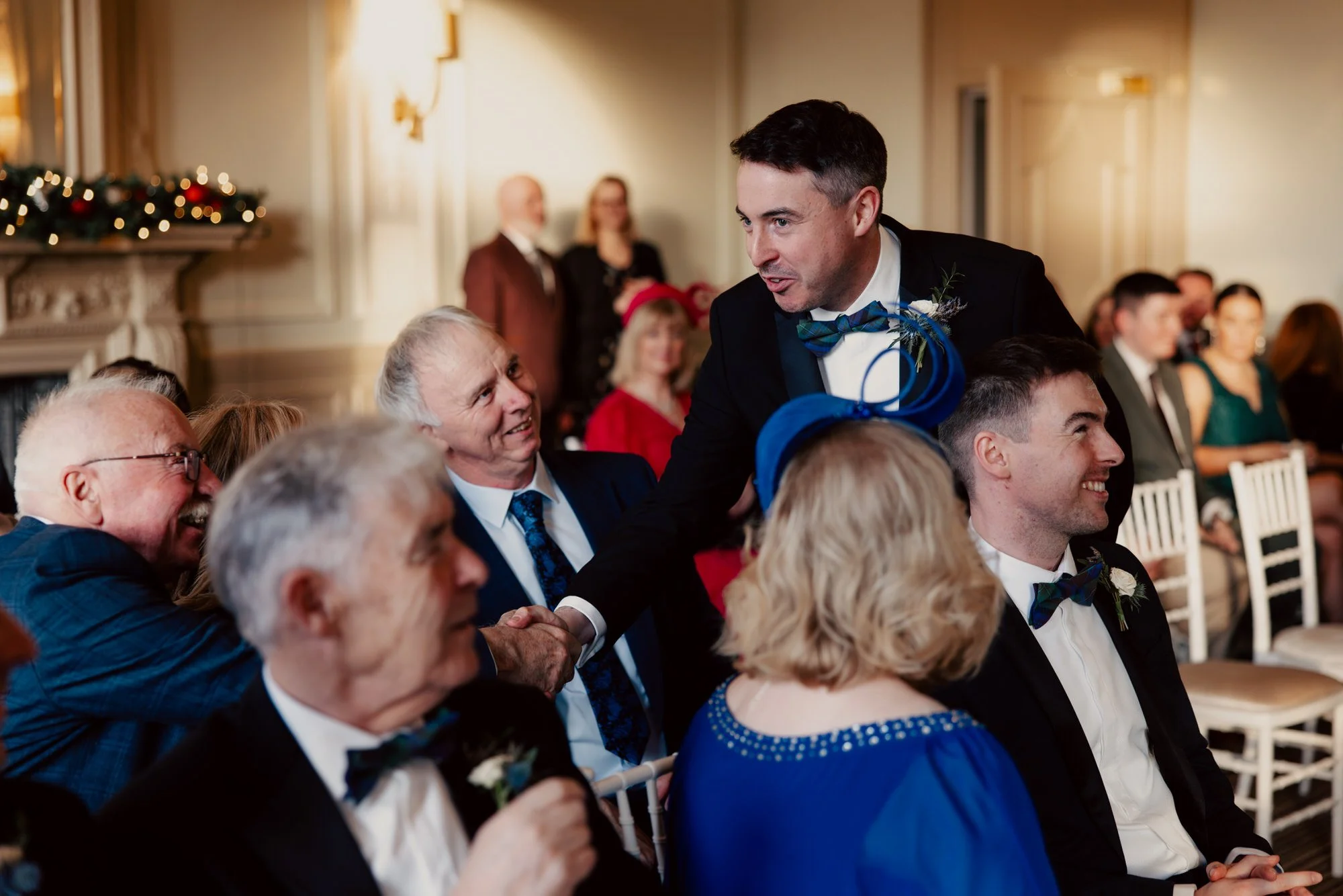 Vincent greeting seated guests before the wedding ceremony.