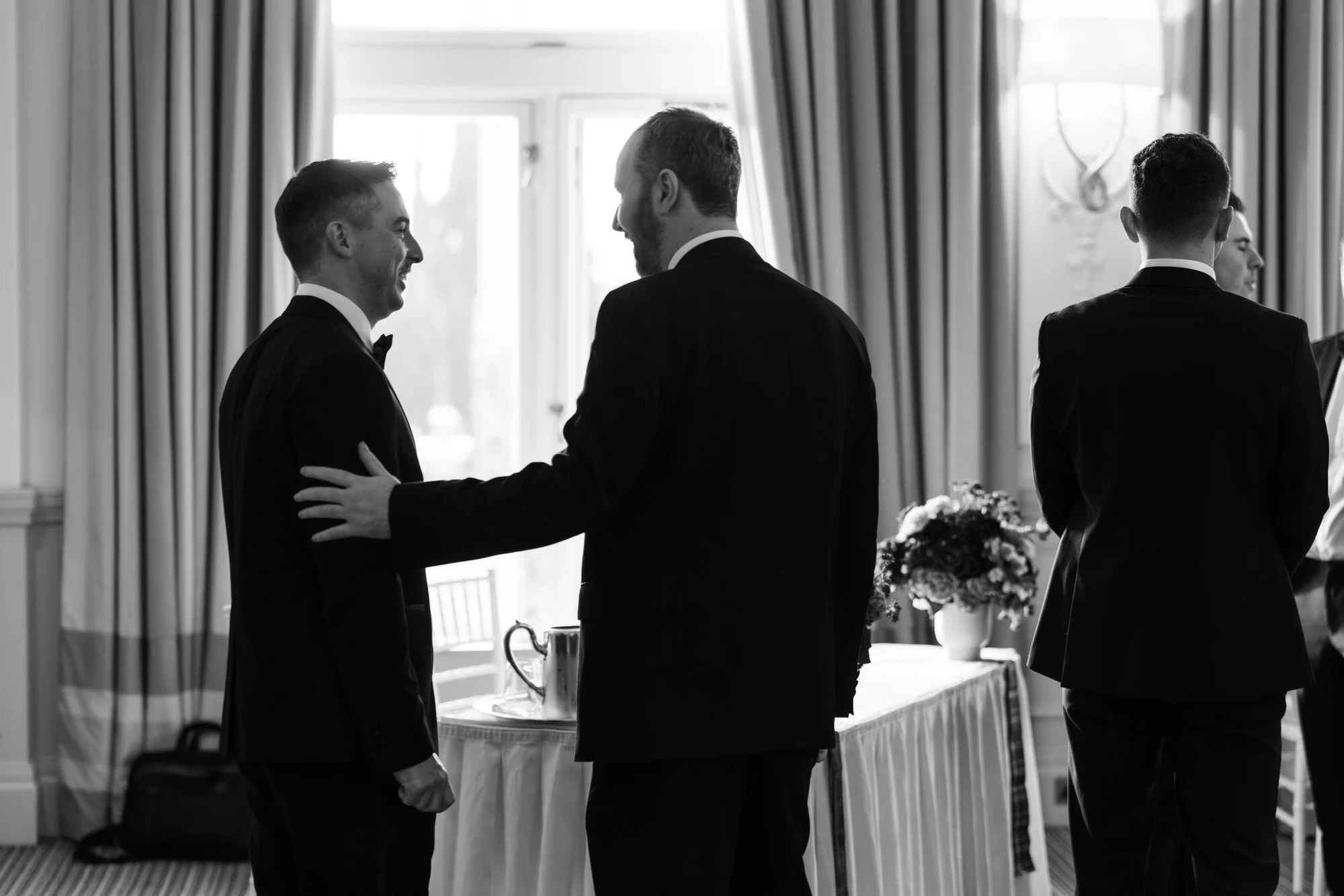 Vincent talking beside a window before the ceremony.