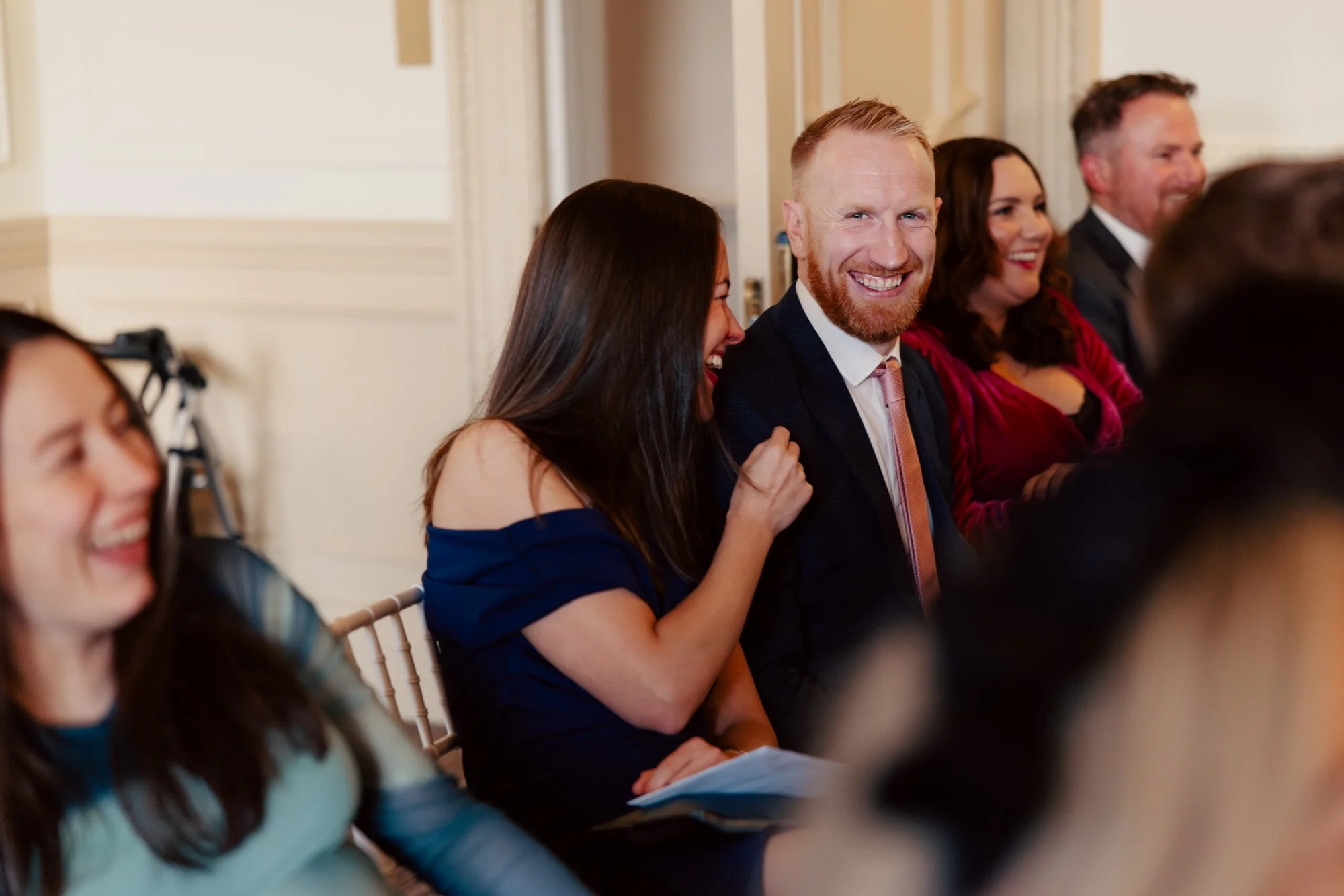 Guests laughing during the ceremony.