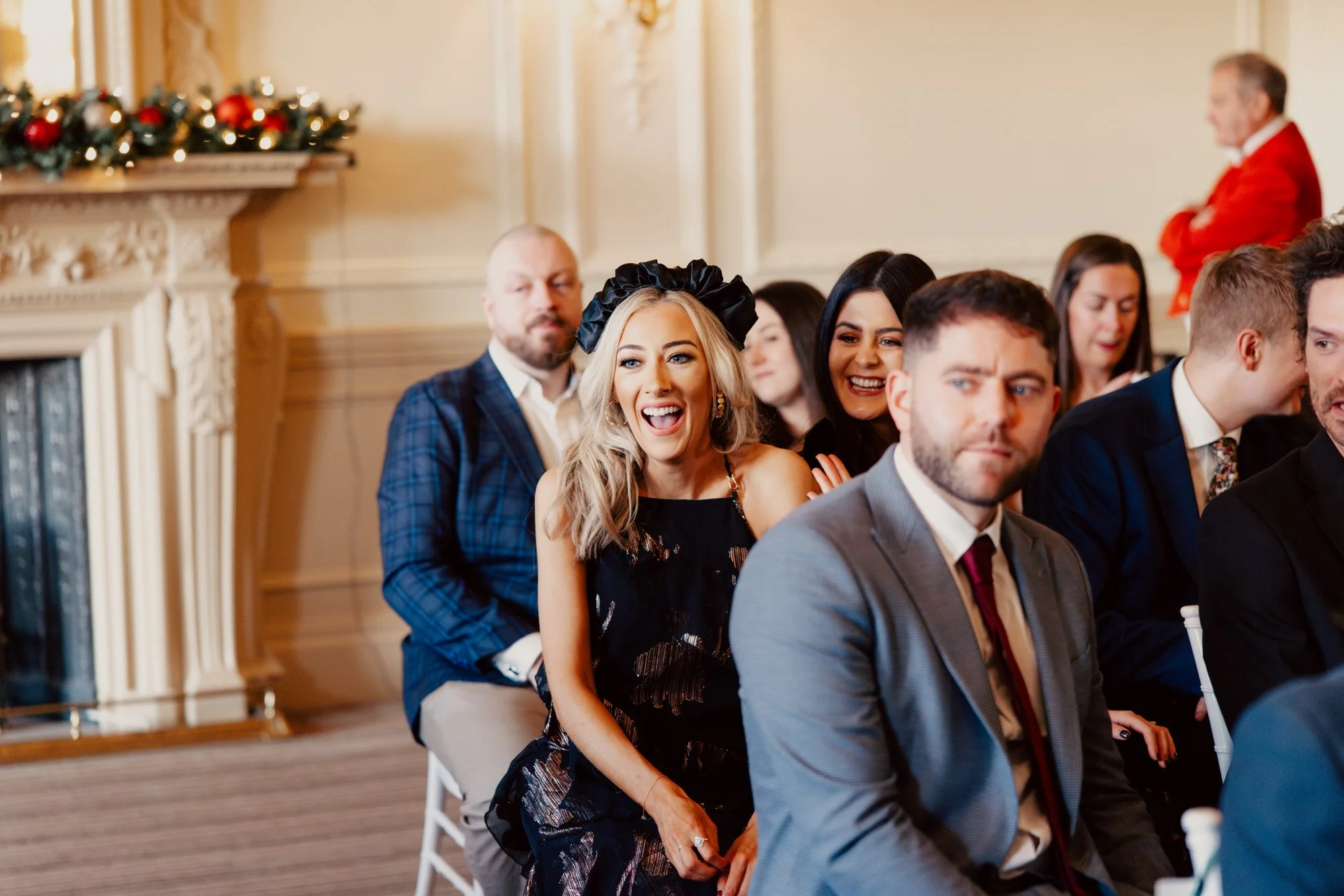 Friends and family watching the couple from their seats.