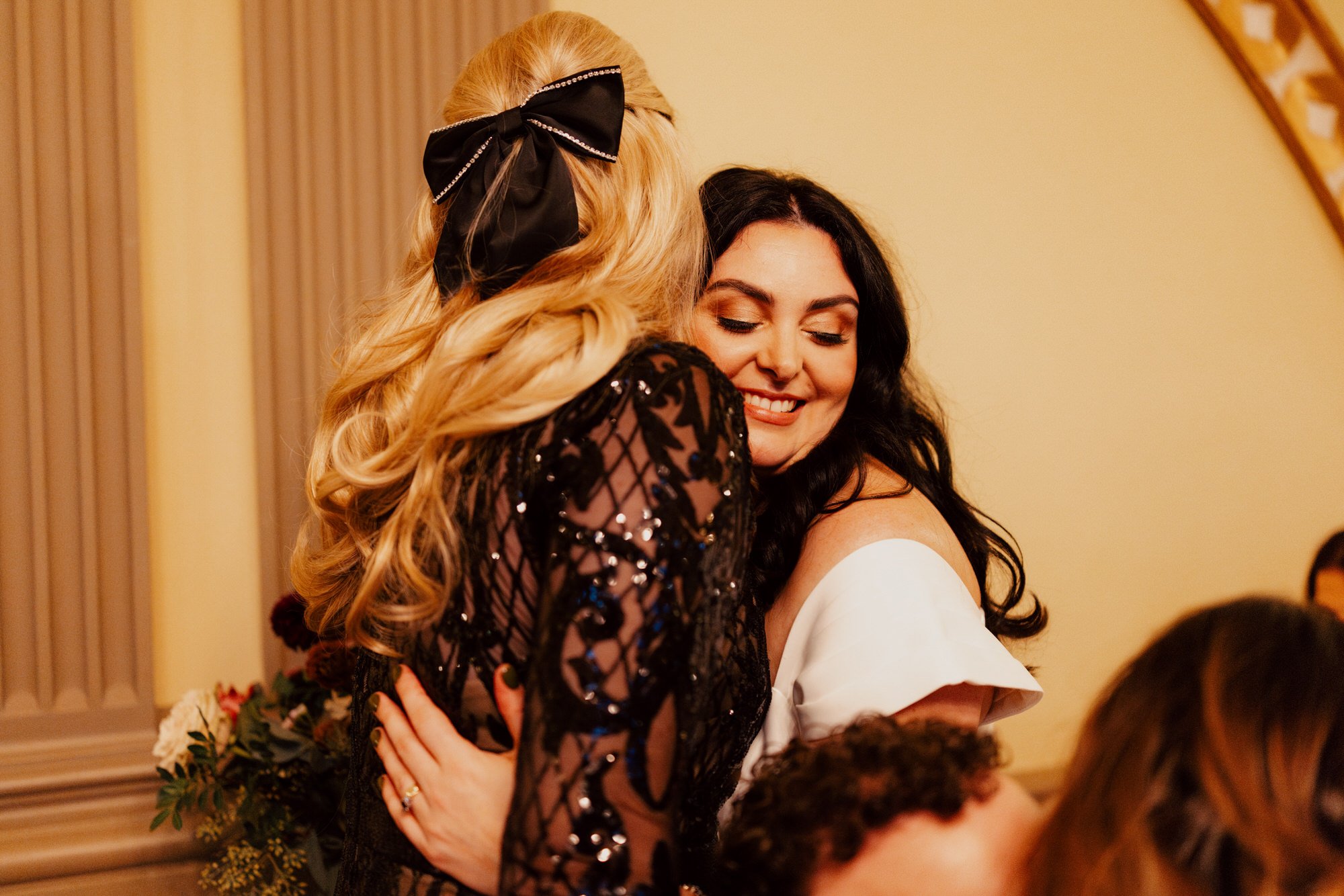 Milly embracing a guest during the drinks reception.
