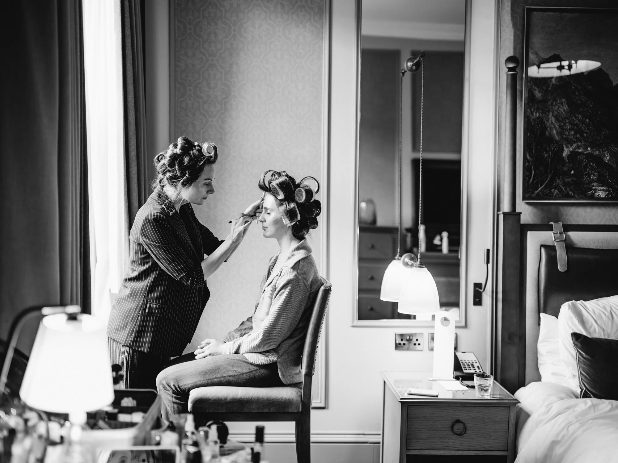 Nicola having her makeup applied beside a window at The George Hotel