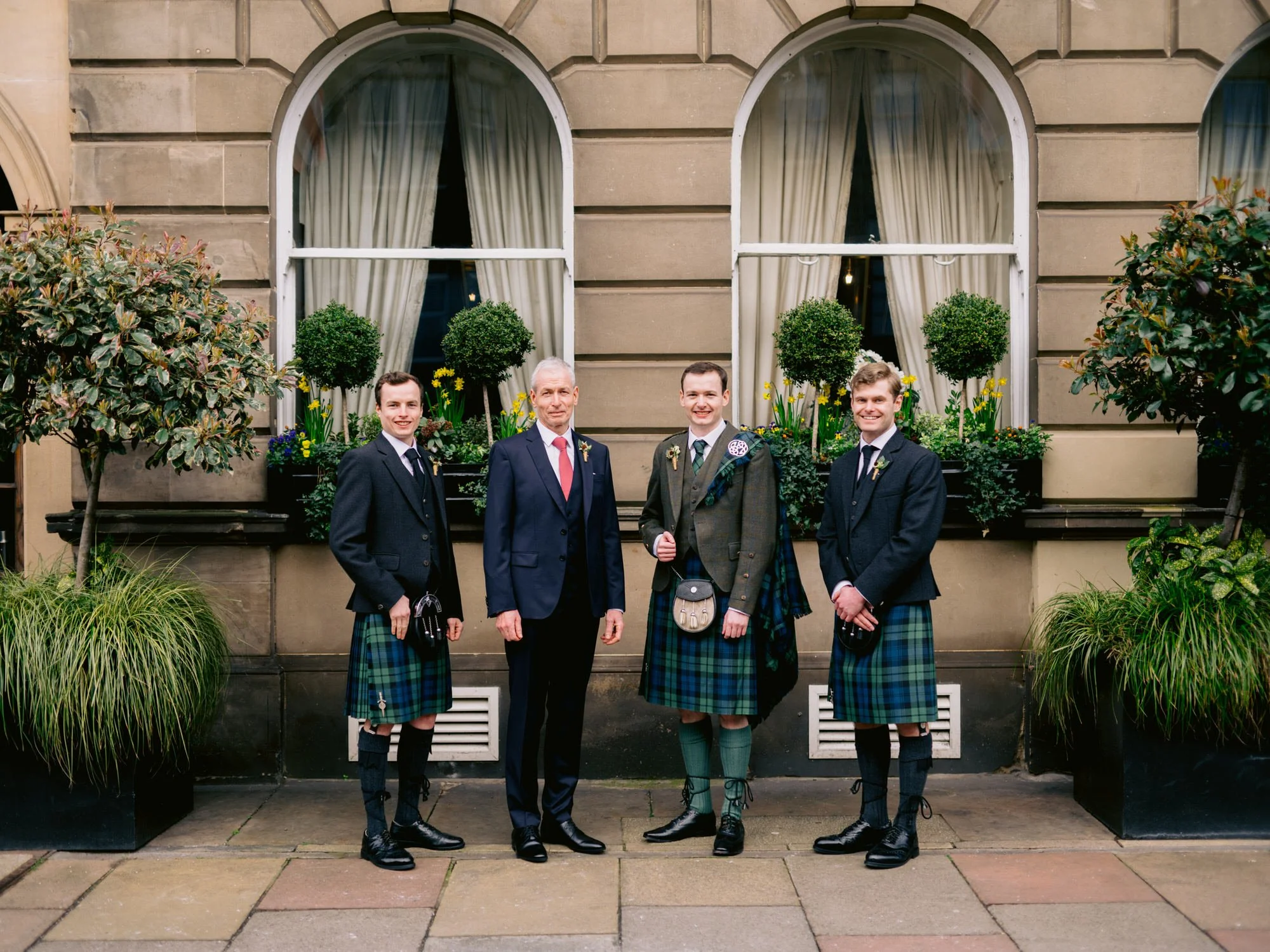 Fraser and the wedding party outside The George Hotel