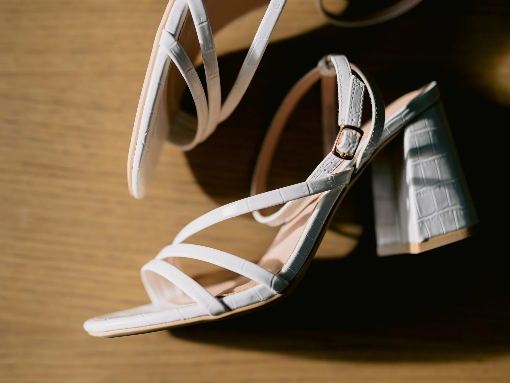 White bridal shoes with tartan heels