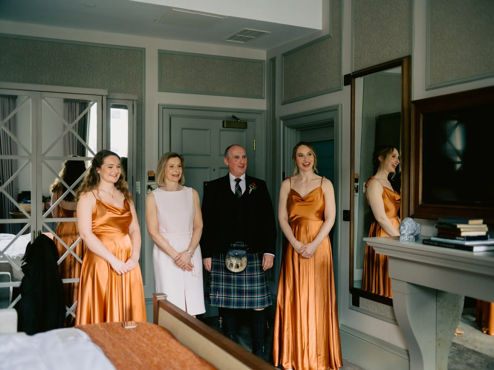 Family and bridesmaids waiting to see Nicola in her dress