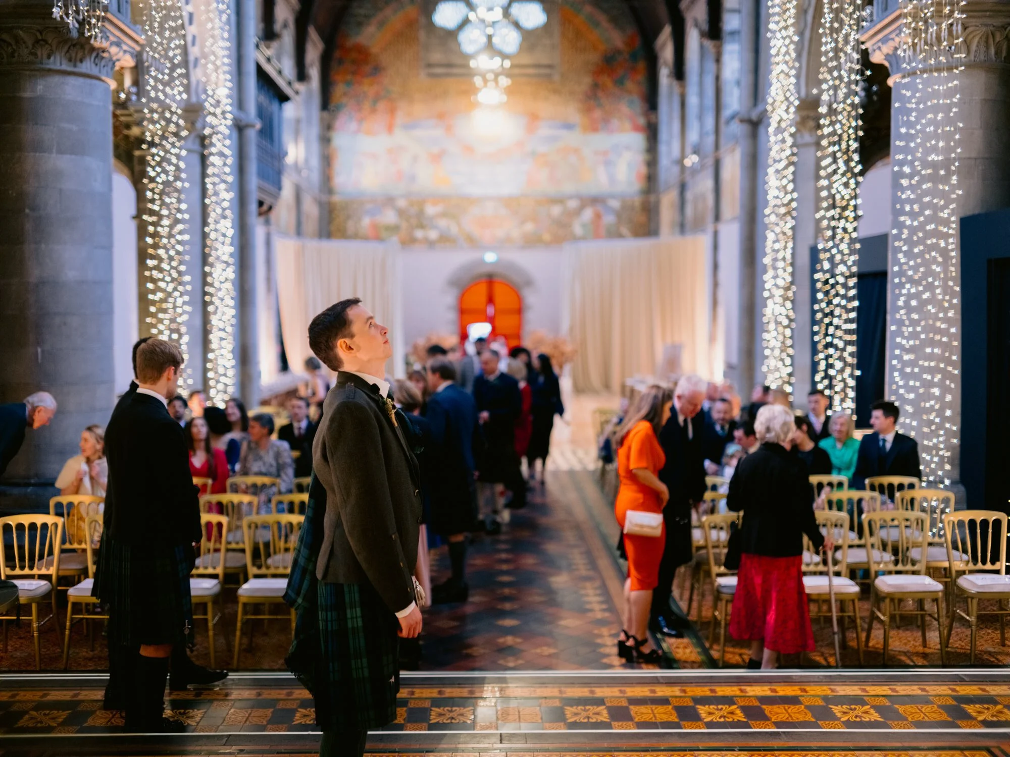Fraser waiting beside the ceremony aisle at Mansfield Traquair