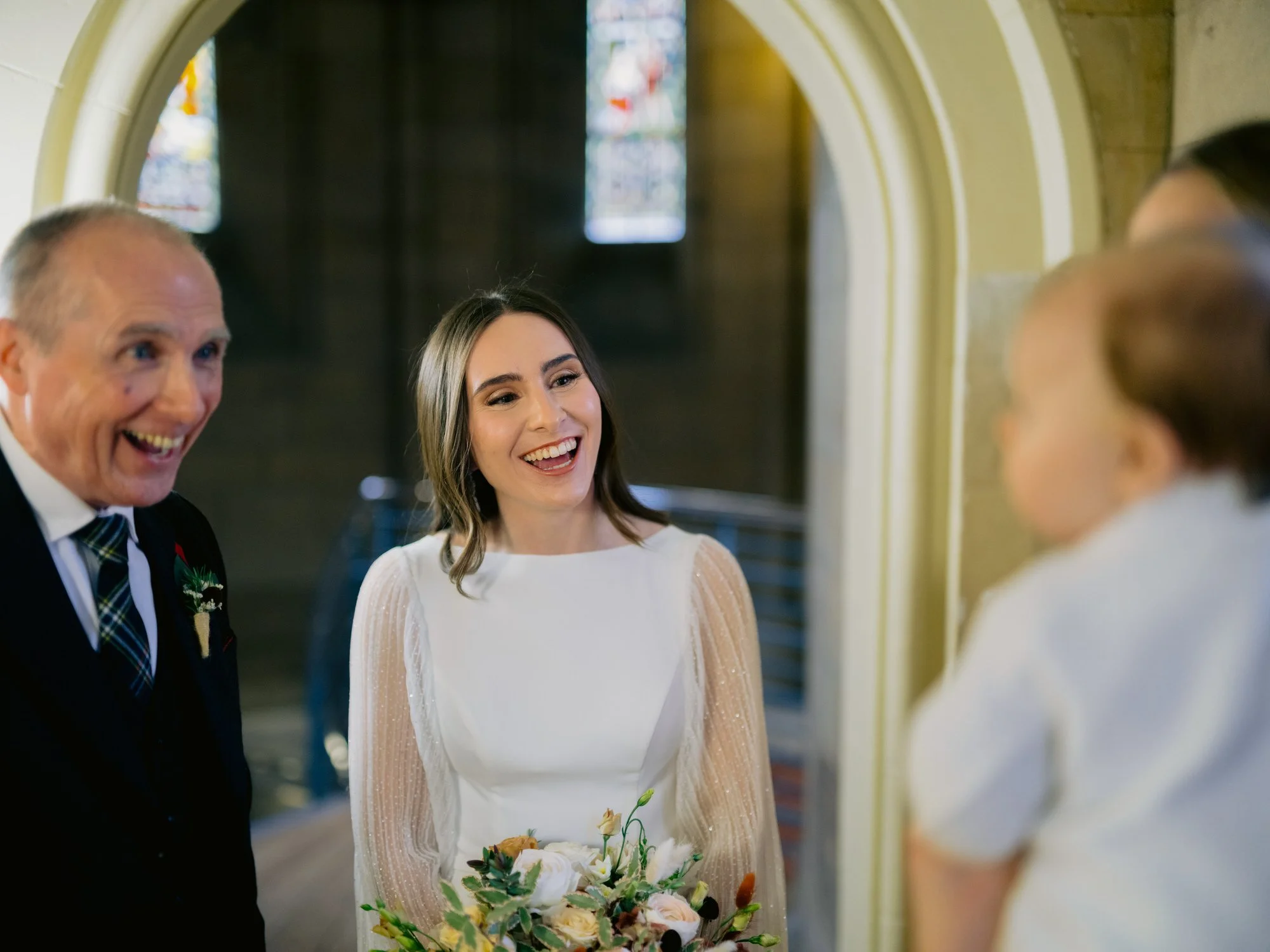 Nicola and her father smiling before the ceremony