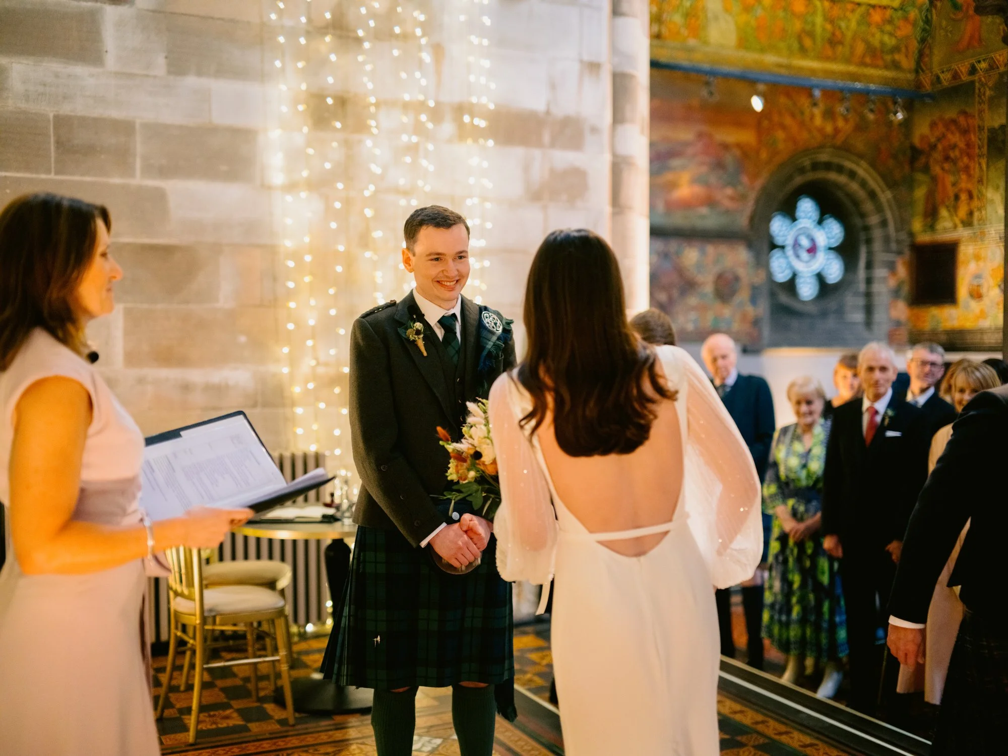 Nicola and Fraser facing one another during their ceremony