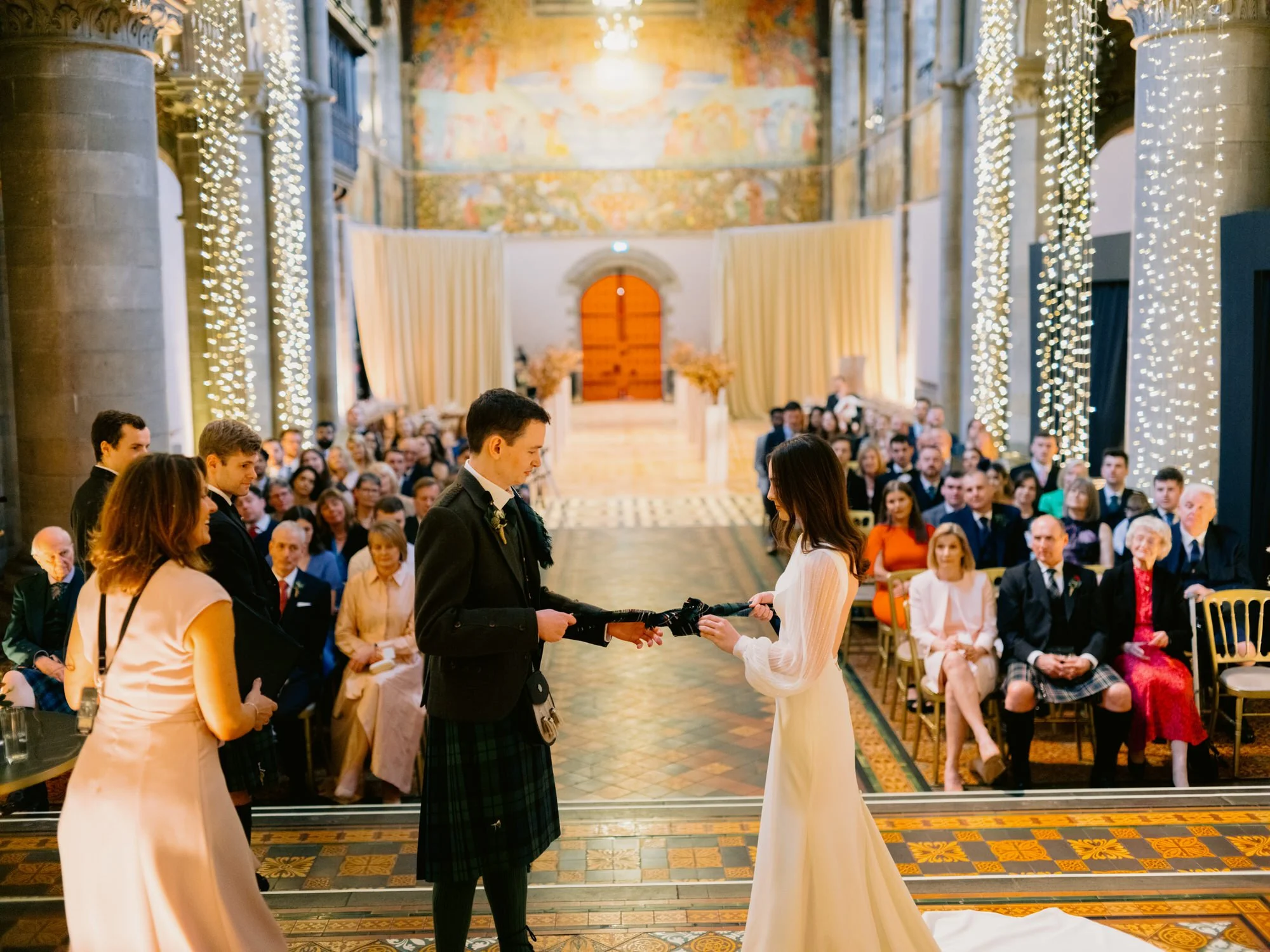 The couple facing their guests during the wedding ceremony