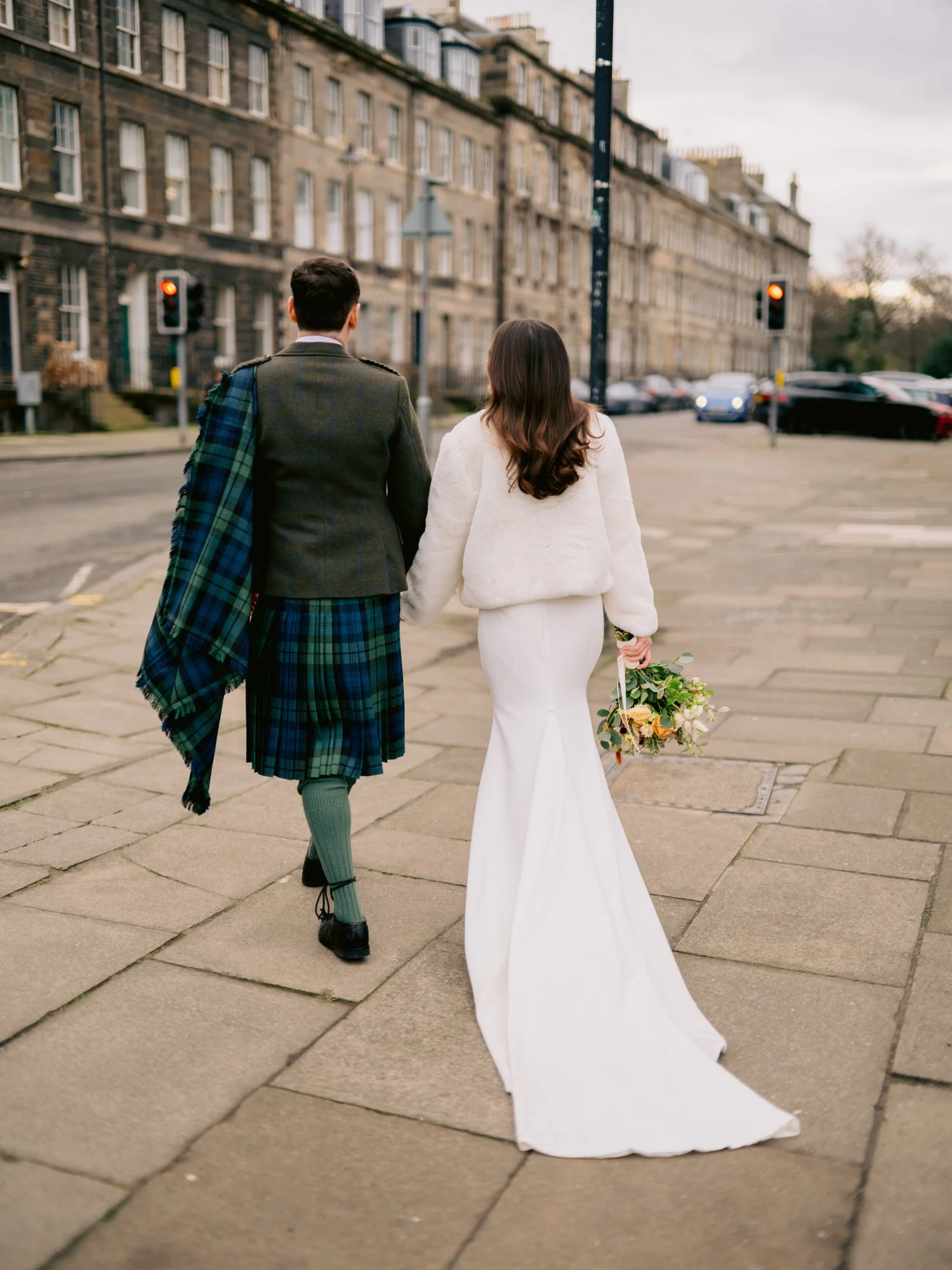 Nicola and Fraser walking away along the pavement