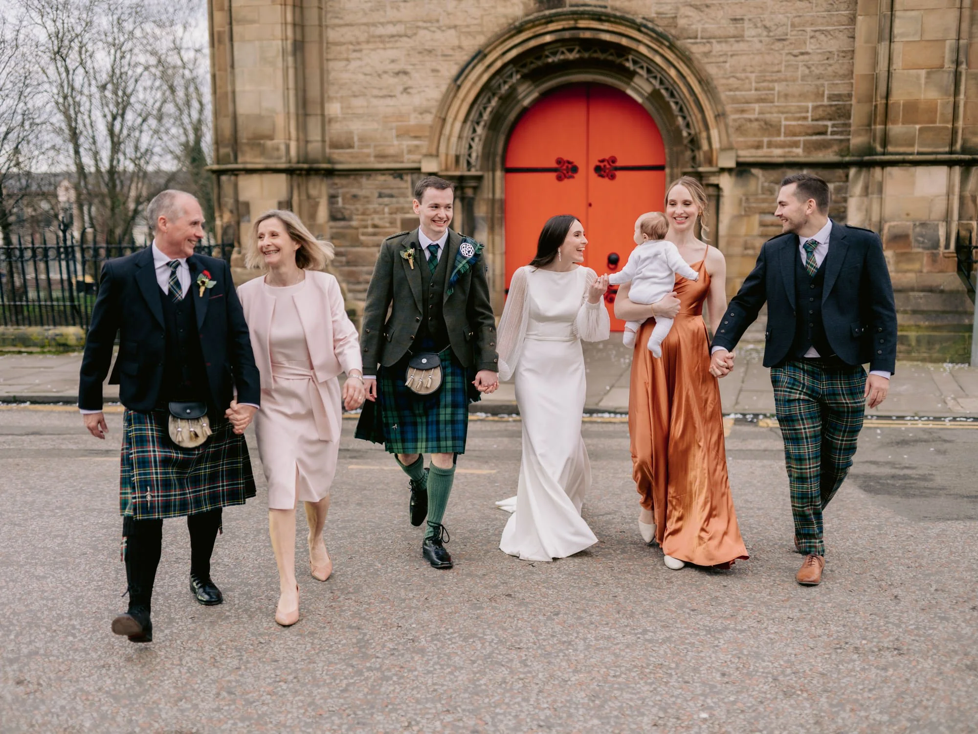 Family walking together outside Mansfield Traquair