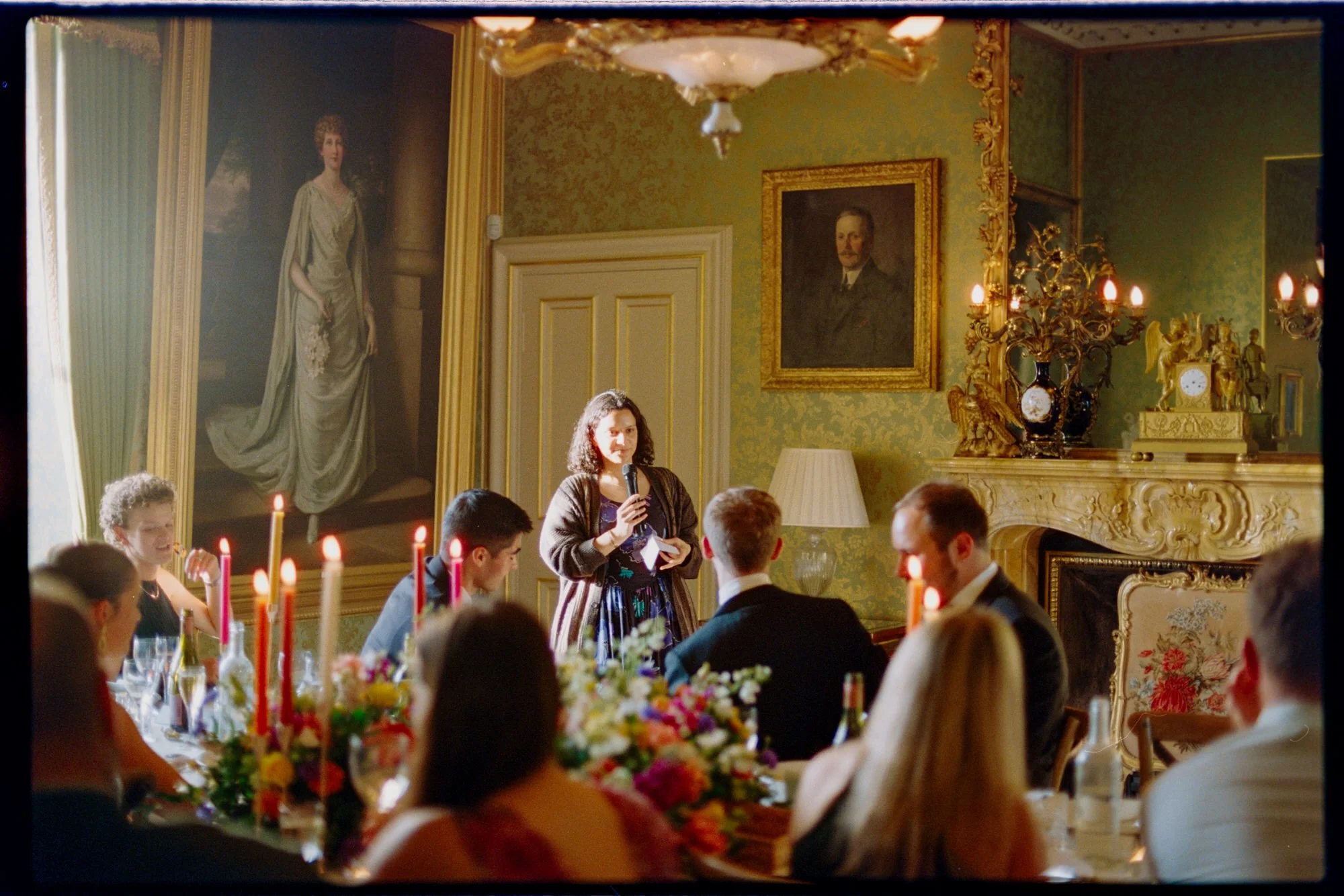 A guest speaking to the newlyweds and their friends over dinner.