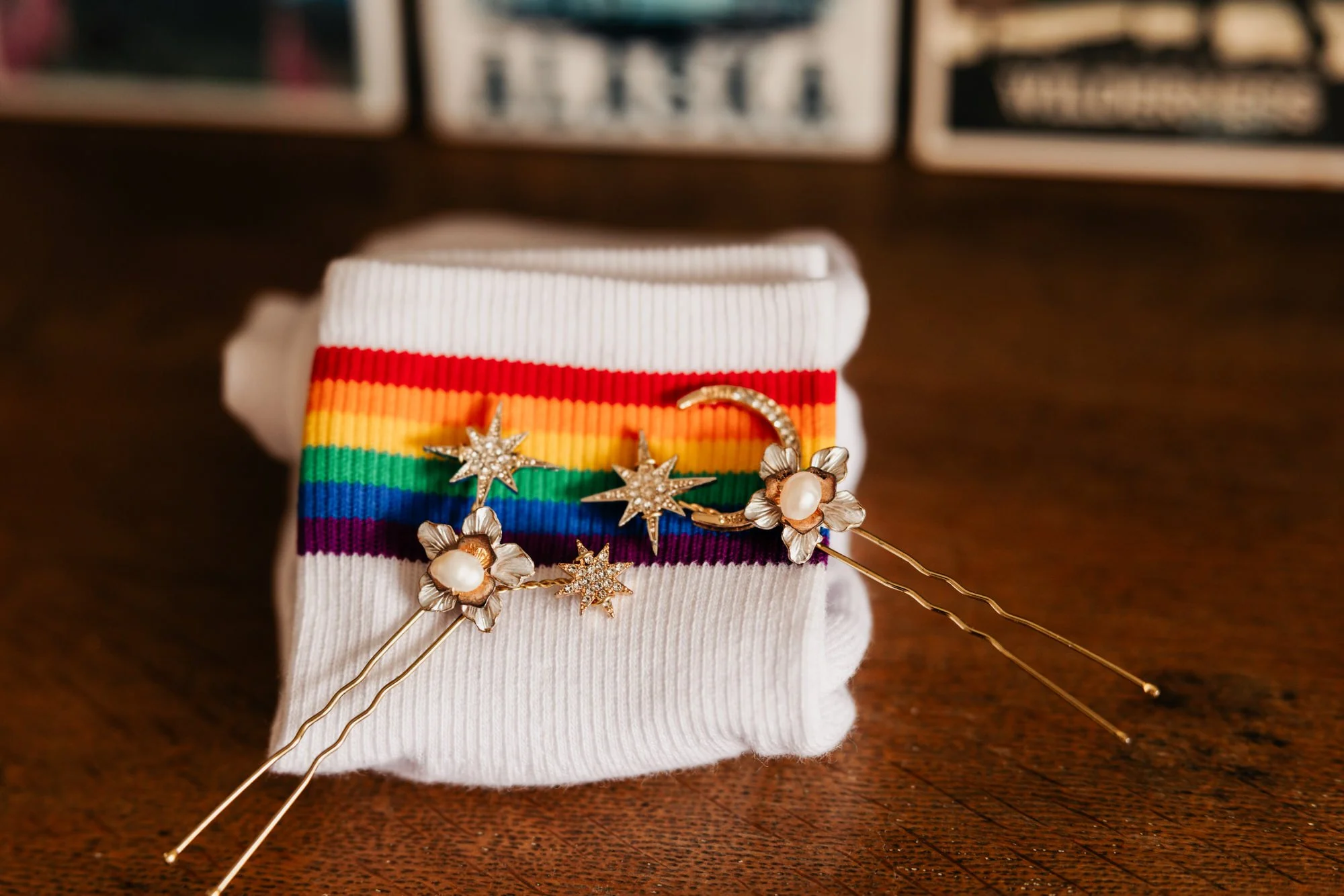 Rainbow ribbons and a floral corsage on white wedding shoes