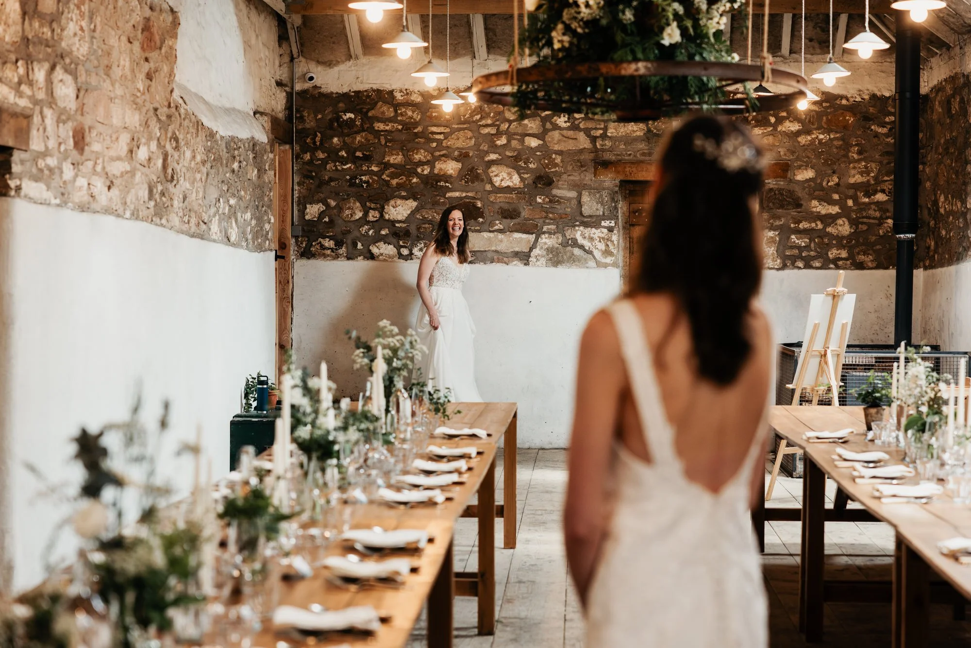 A bride entering The Free Company’s long-table dining room