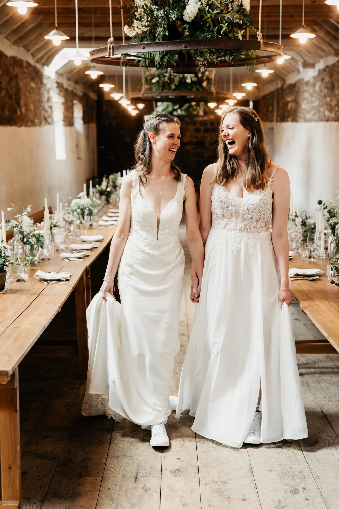 The brides walking through the dining room together