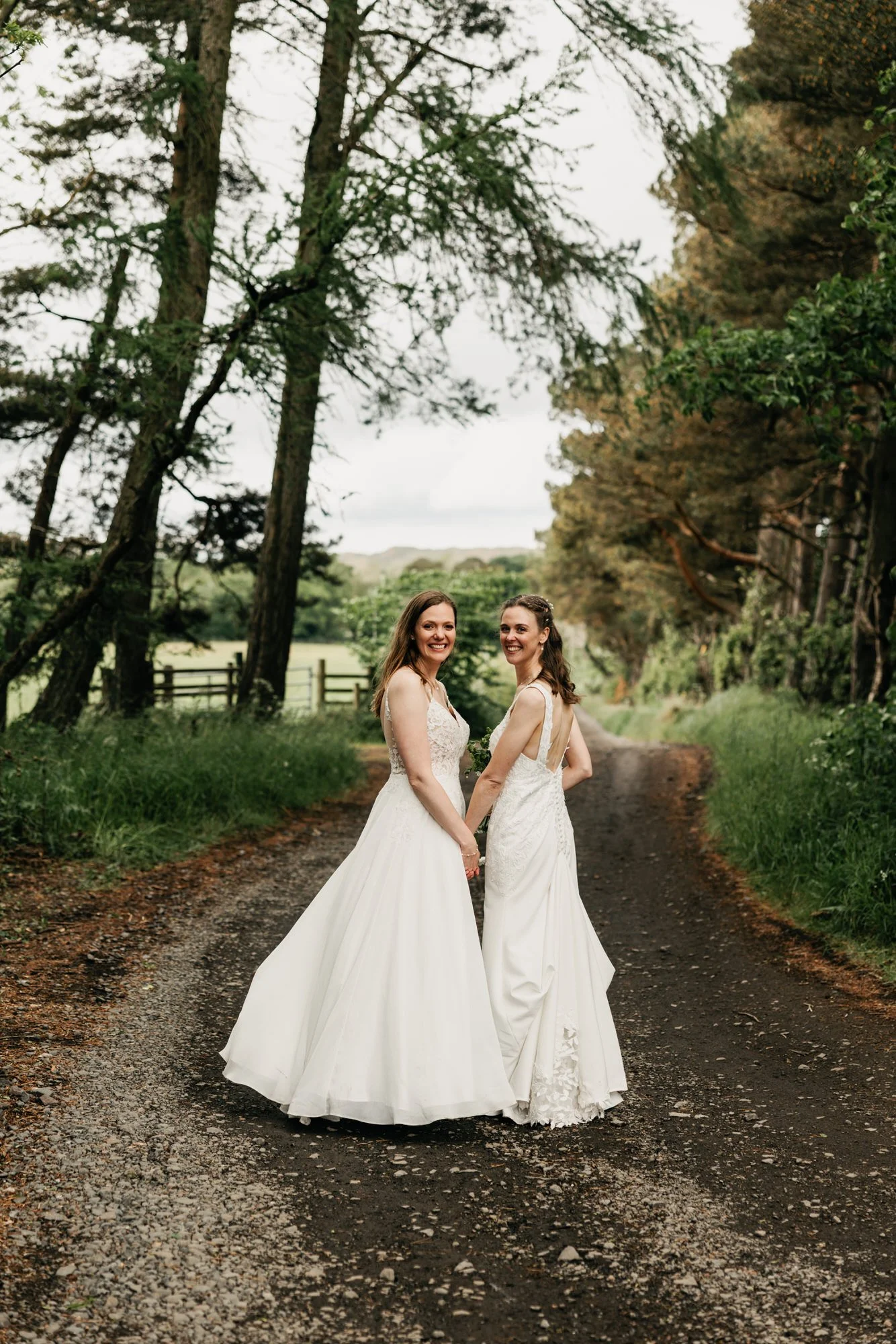 Jackie and Briony on a tree-lined path beside the venue