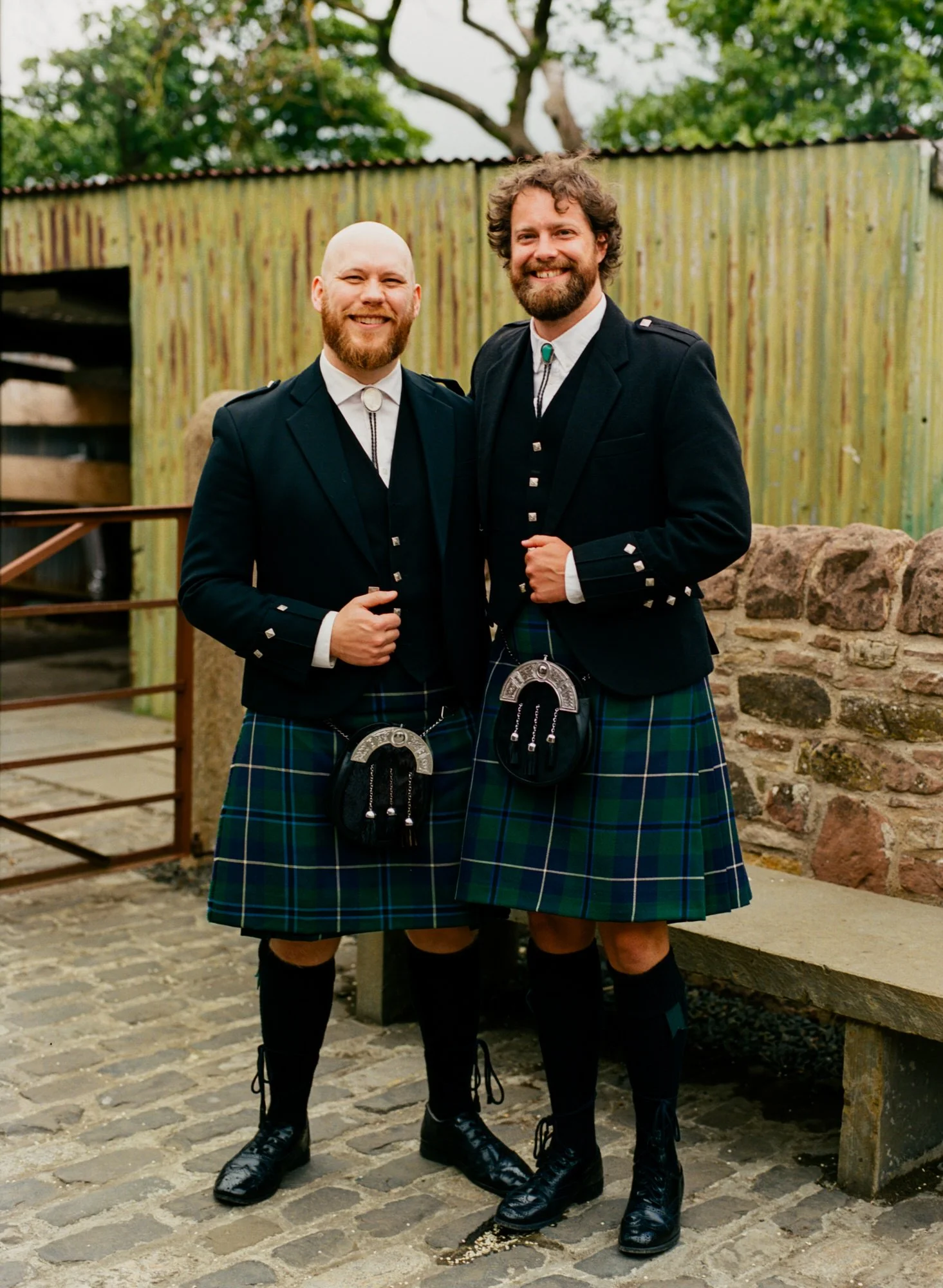 Guests in kilts and suits at the wedding reception
