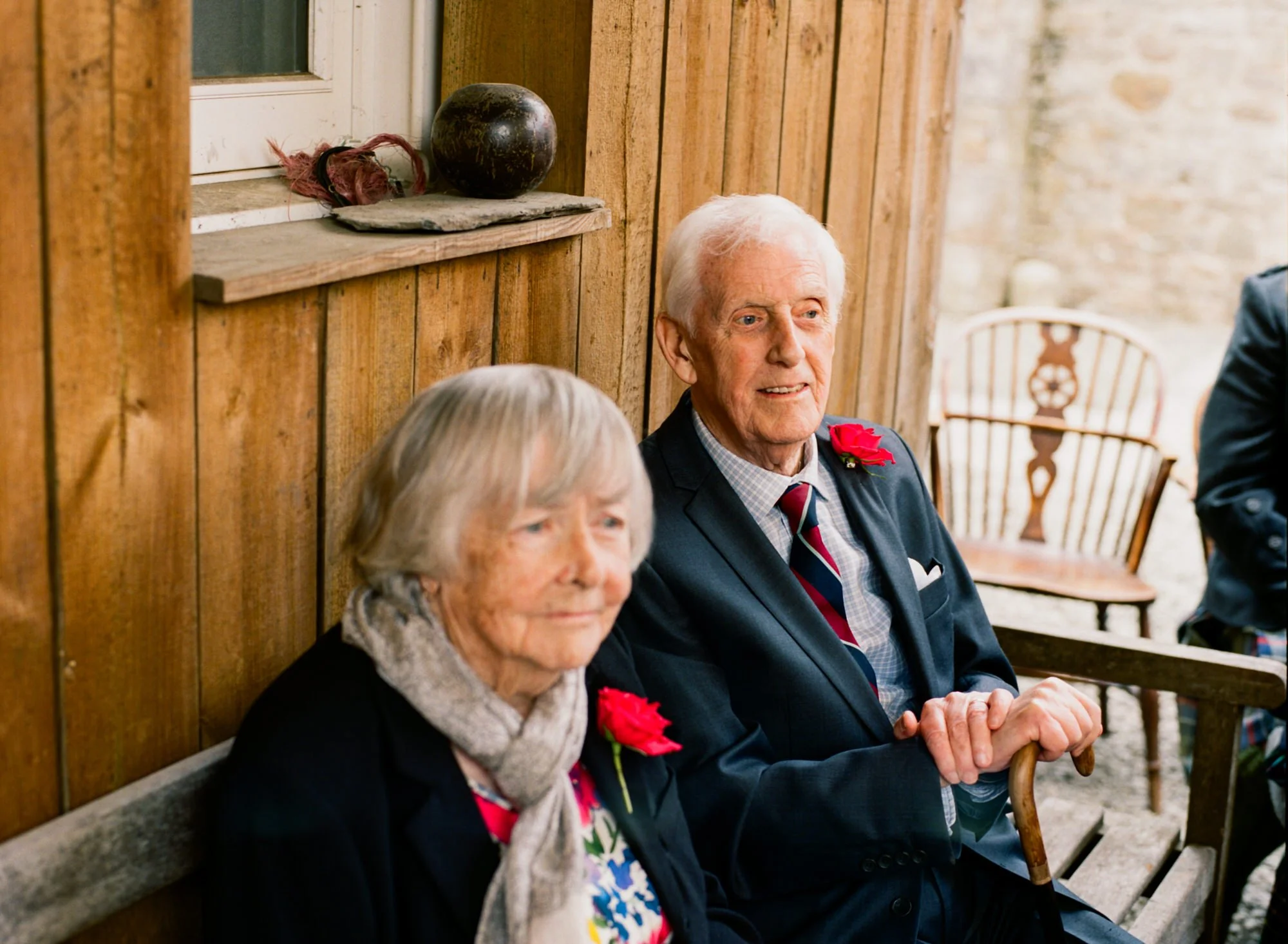 An older couple sitting together during the reception
