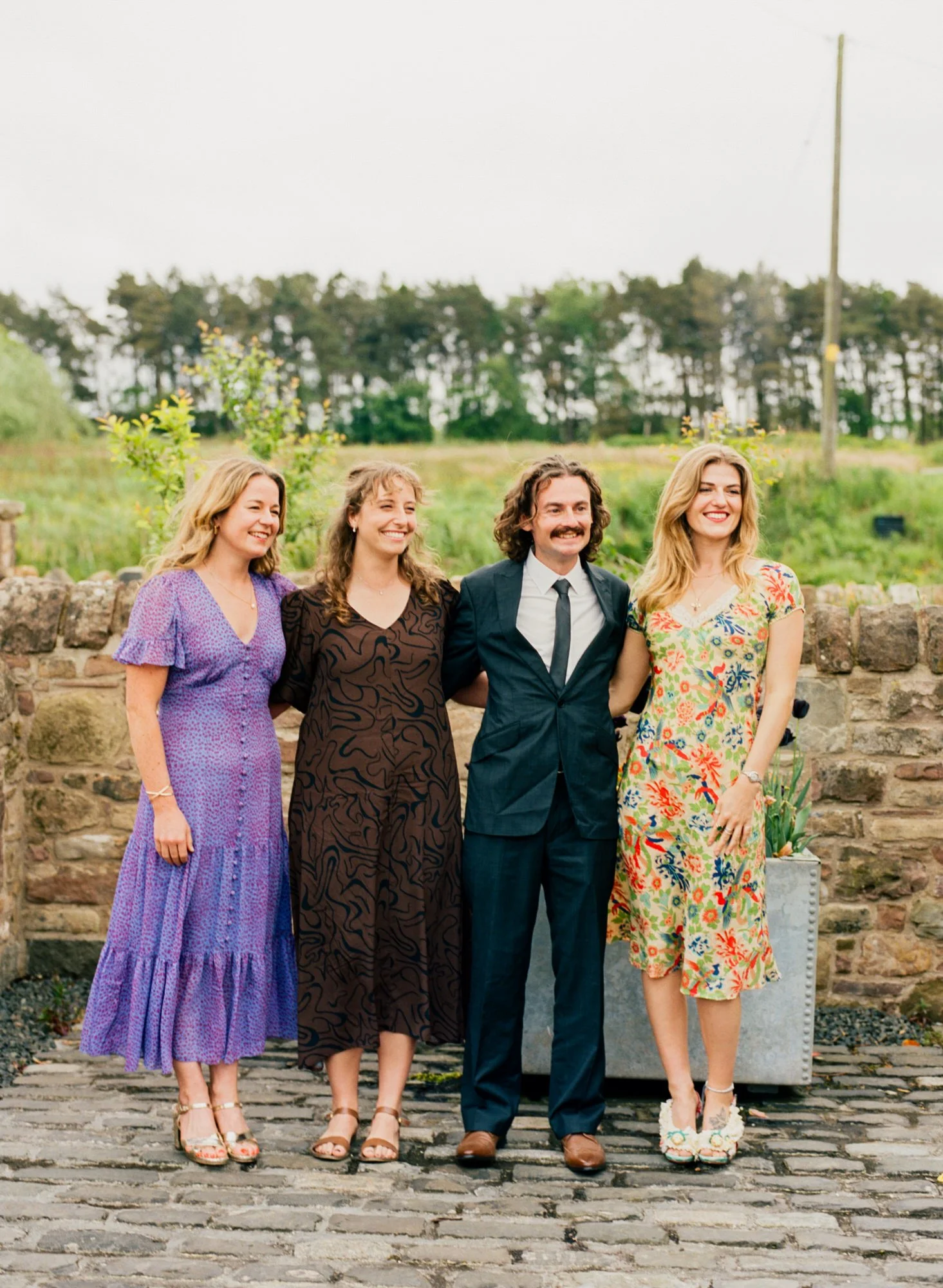 The wedding party gathered for a group photograph