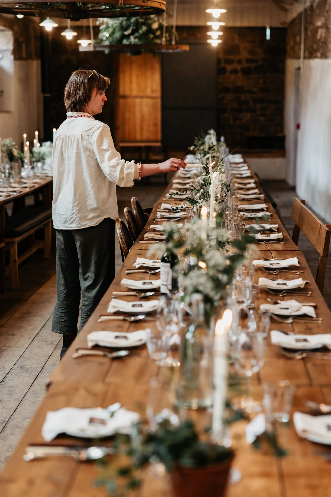 A guest looking at the wedding table settings