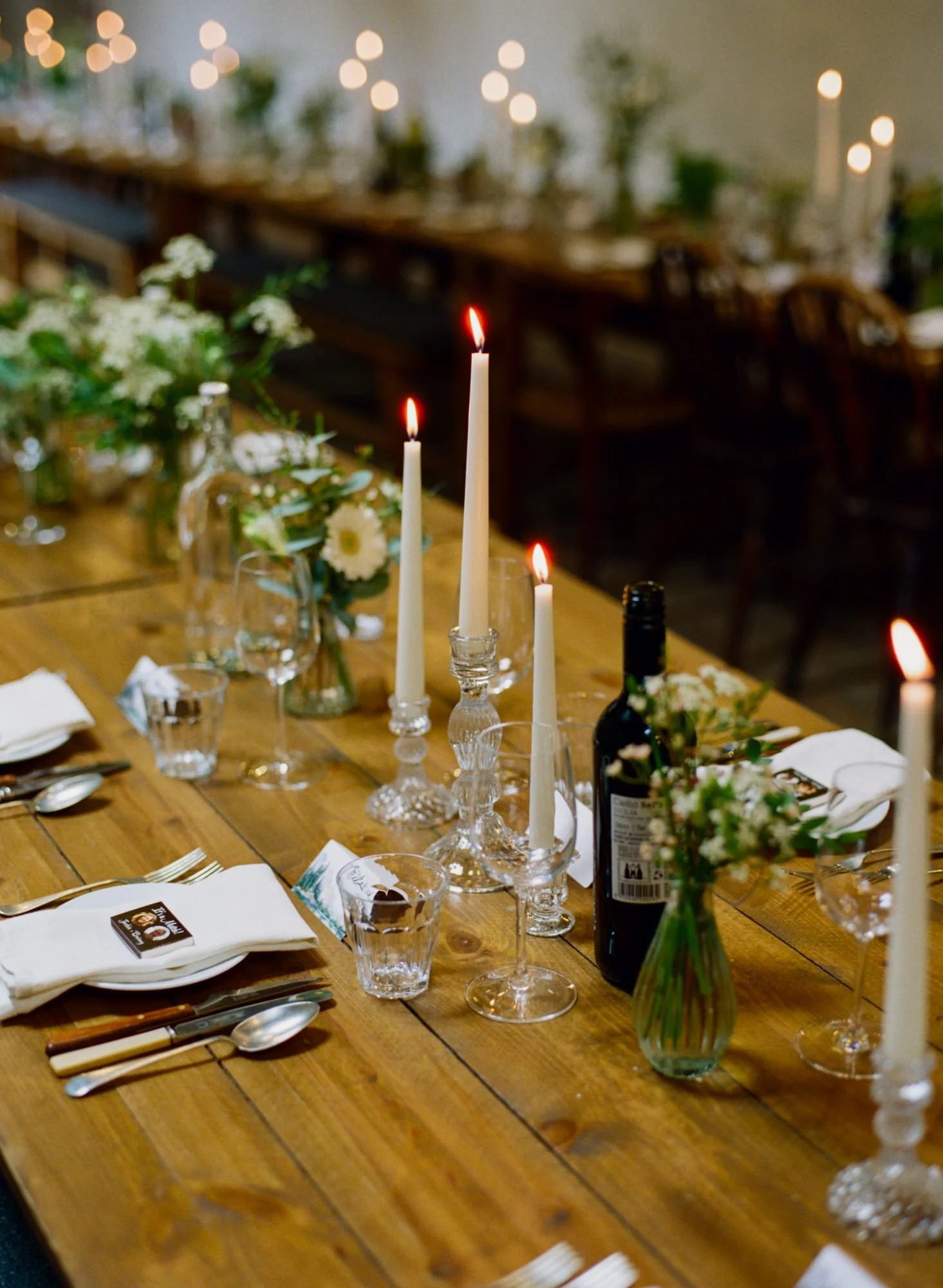 Candles on the wooden wedding dinner table