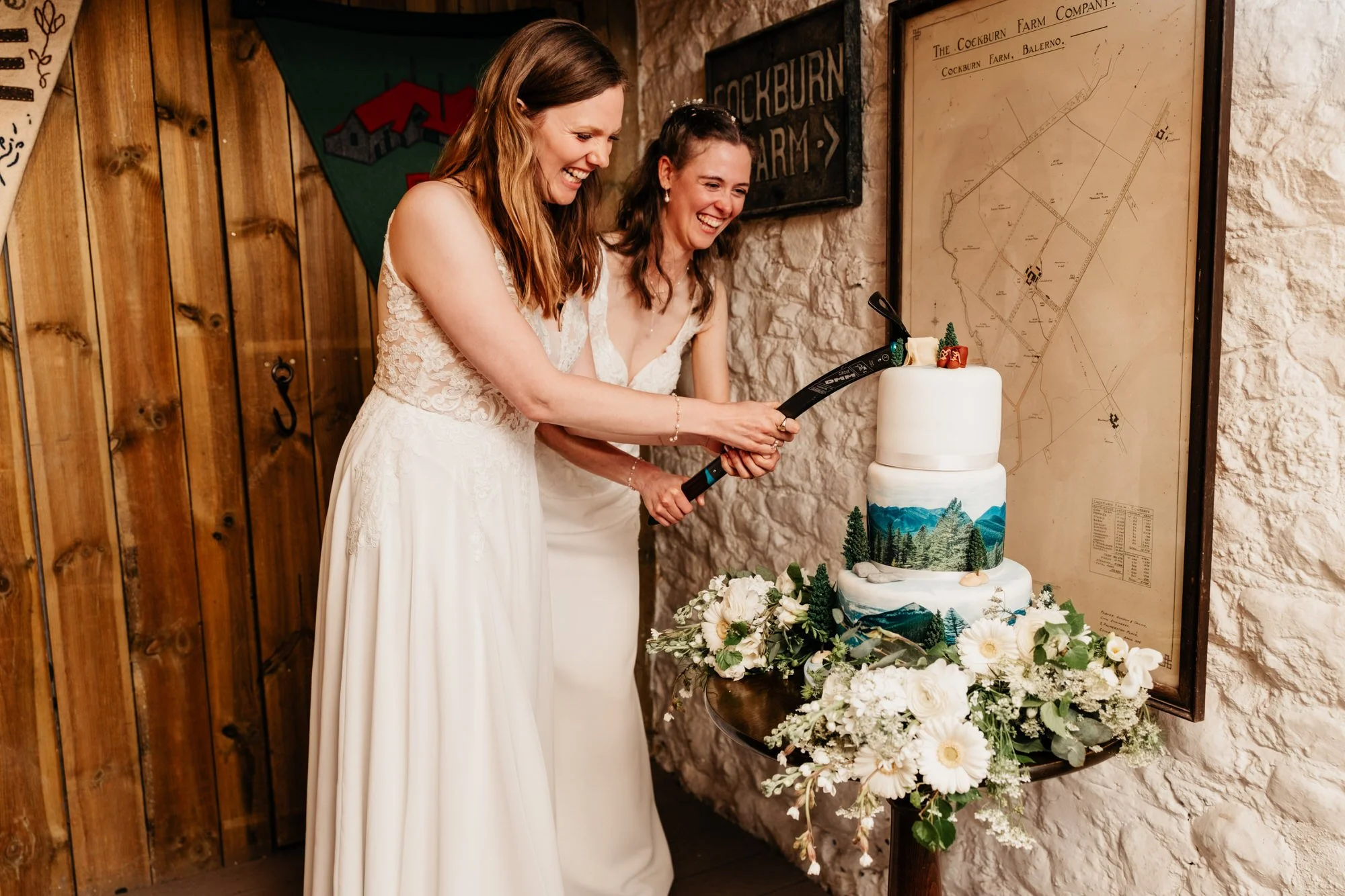 Jackie and Briony cutting their wedding cake
